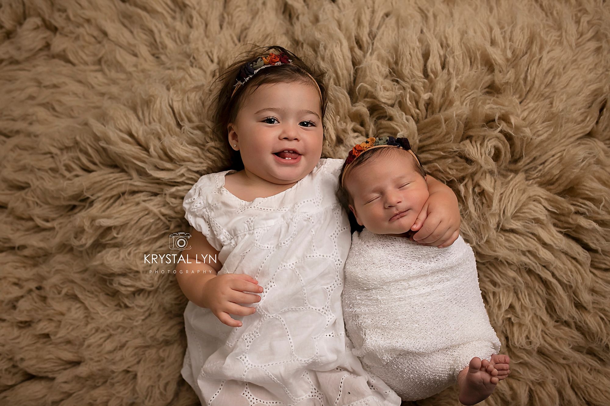 Little sisters all dressed up and ready for their photo opportunity