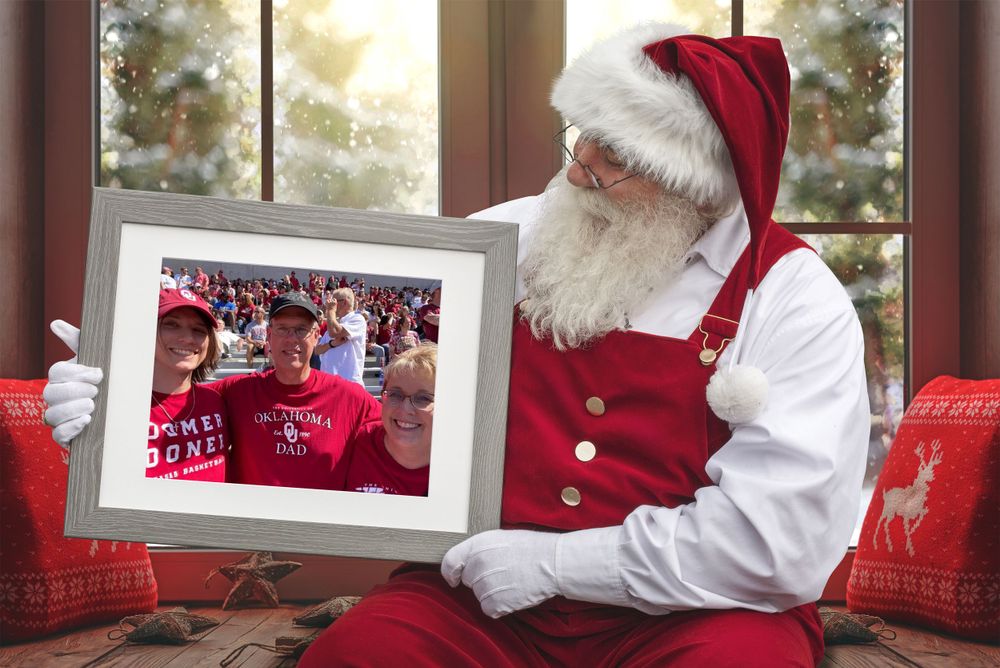 Santa holds up a family photo.