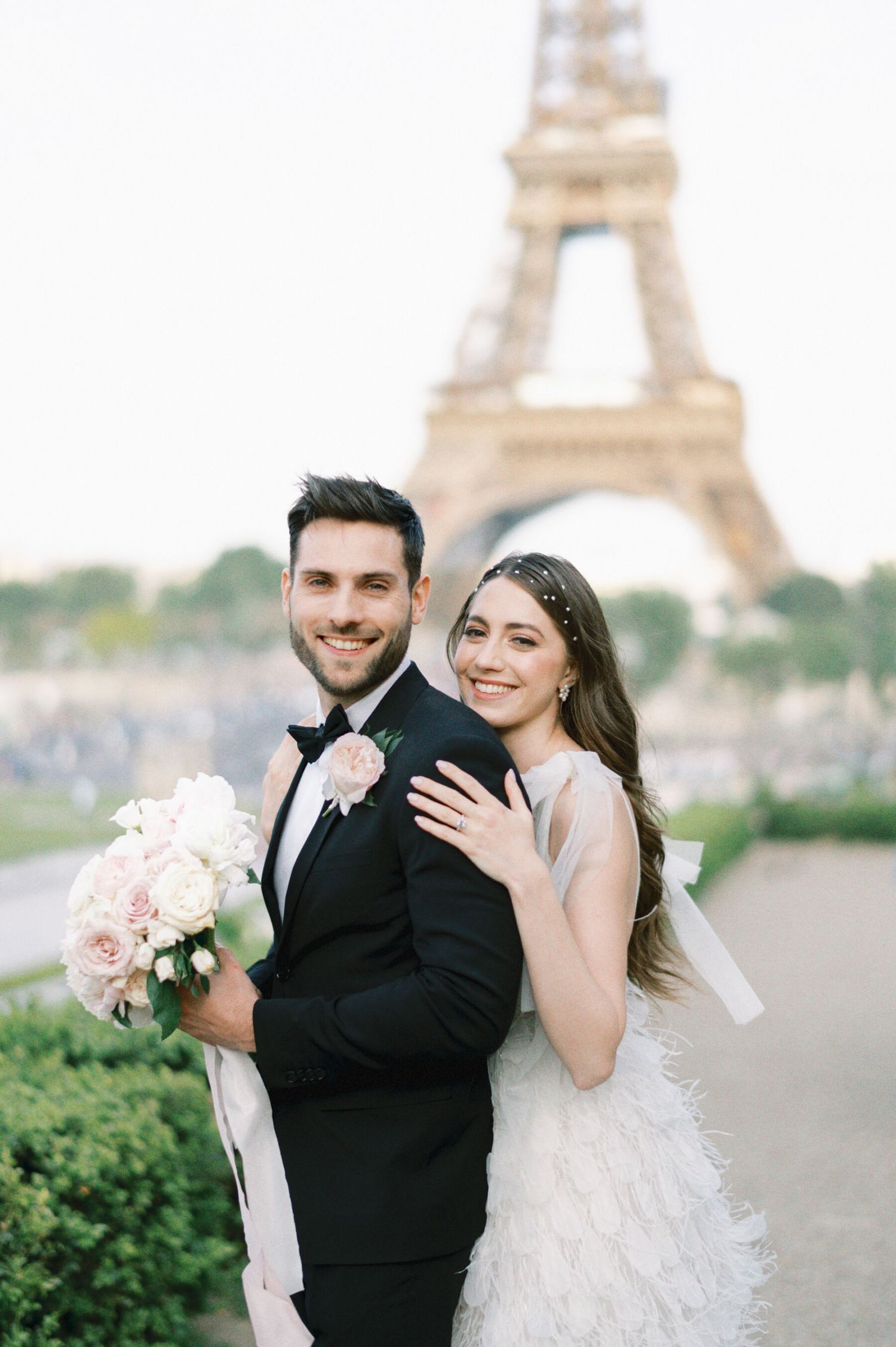 Romantic wedding photoshoot with Eiffel Tower backdrop in Paris.