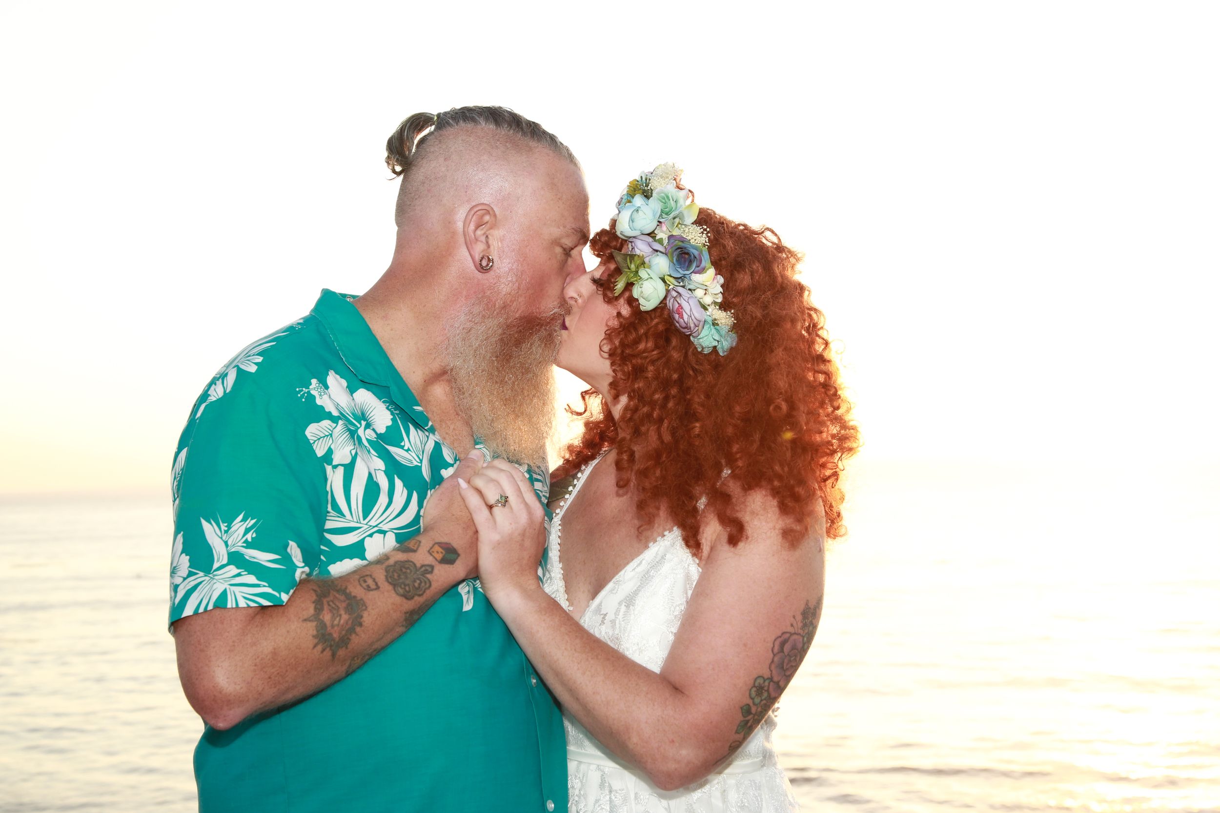 Intimate beach wedding portraits with turquoise and white color scheme.