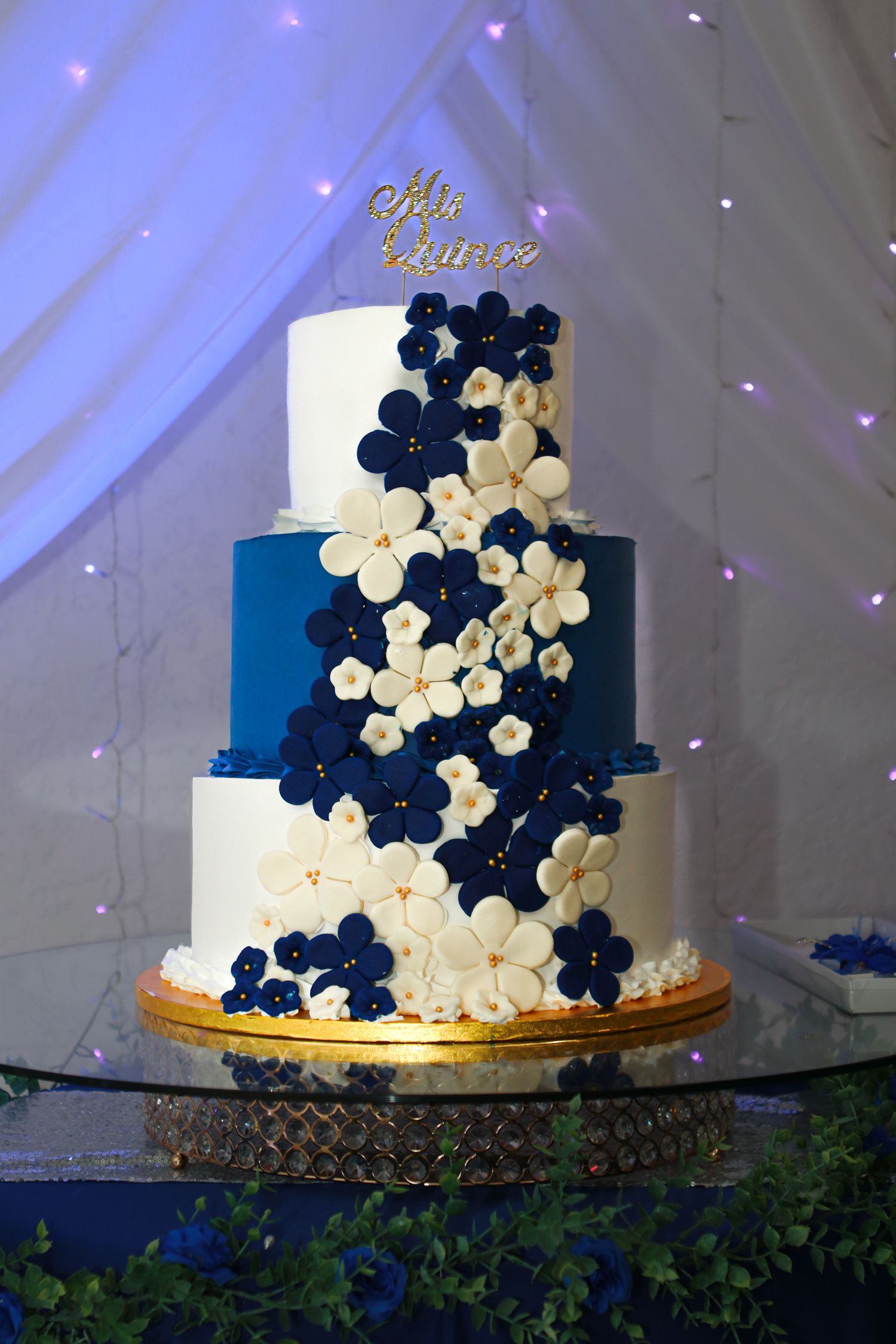 Blue and white flowery Quinceanera cake