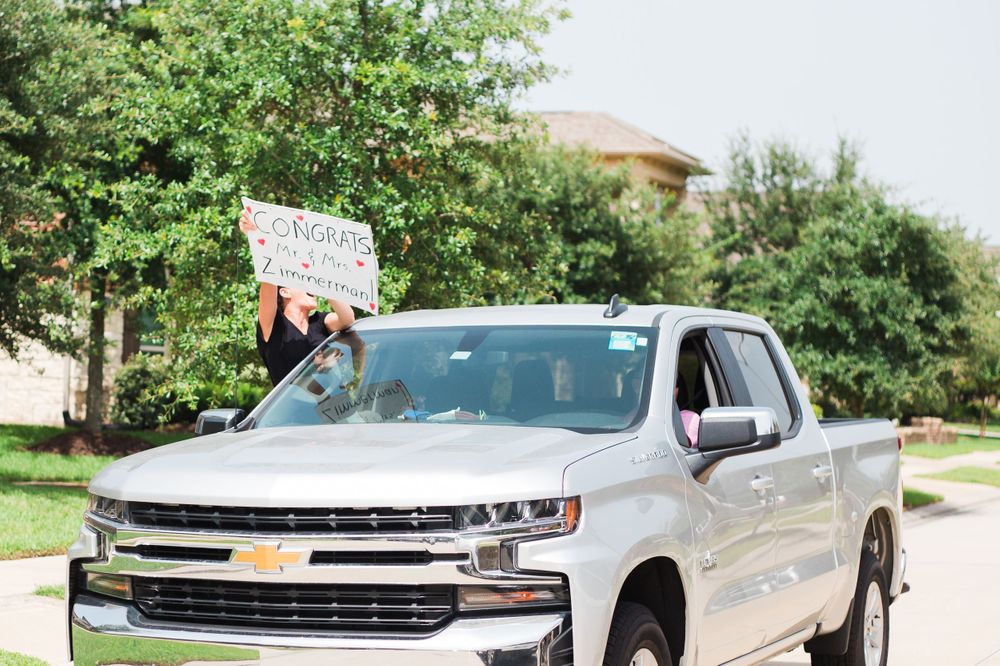 White Chevrolet Silverado pickup truck parked in a residential driveway.