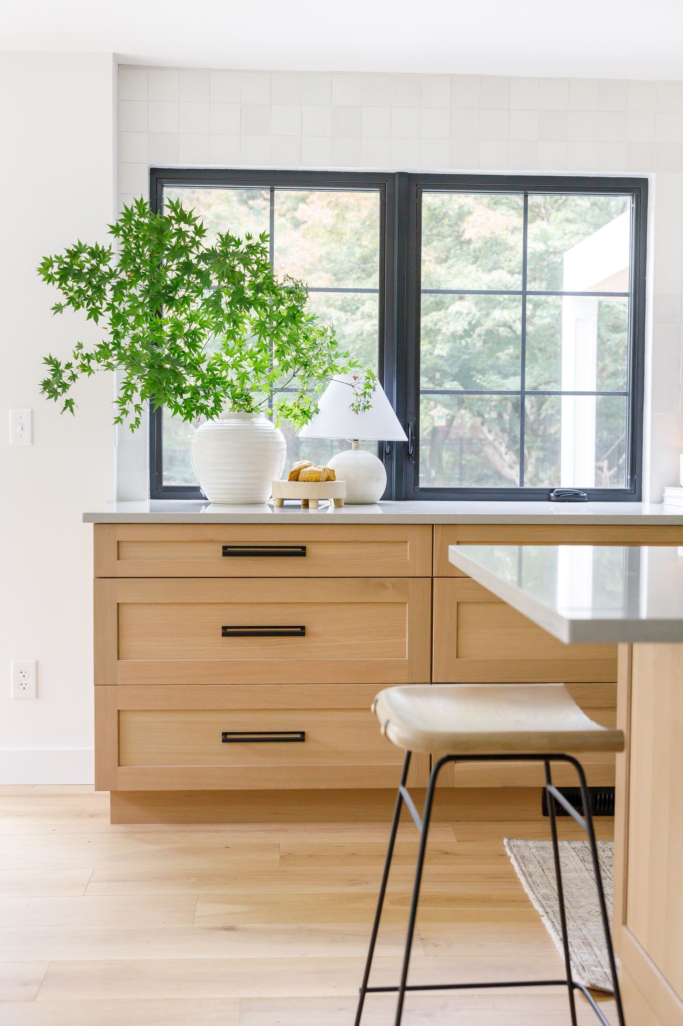 H. Bero Interior Design photos kitchen with tree branches and lamp and stool on counter in Bellevue, WA