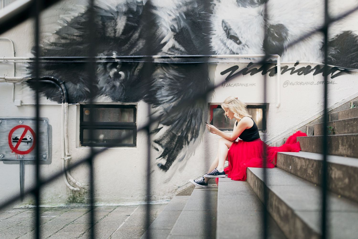 Abstract urban photography series with motion blur and red accents against architectural elements.