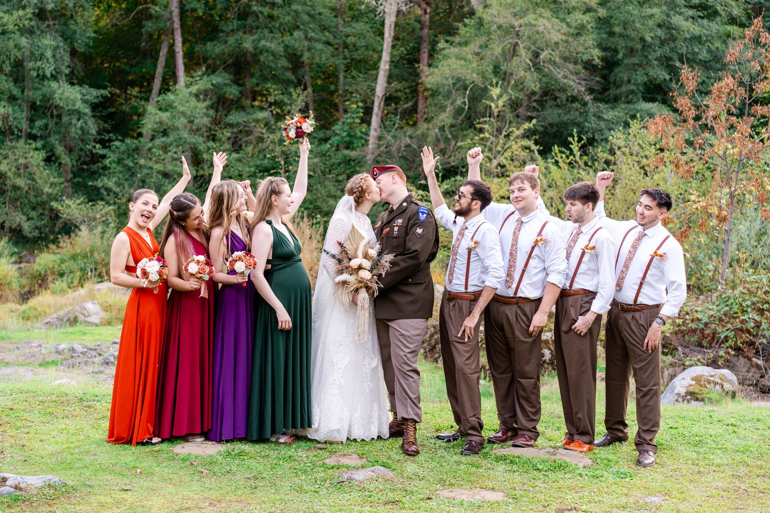 all cheer while bride and groom kiss