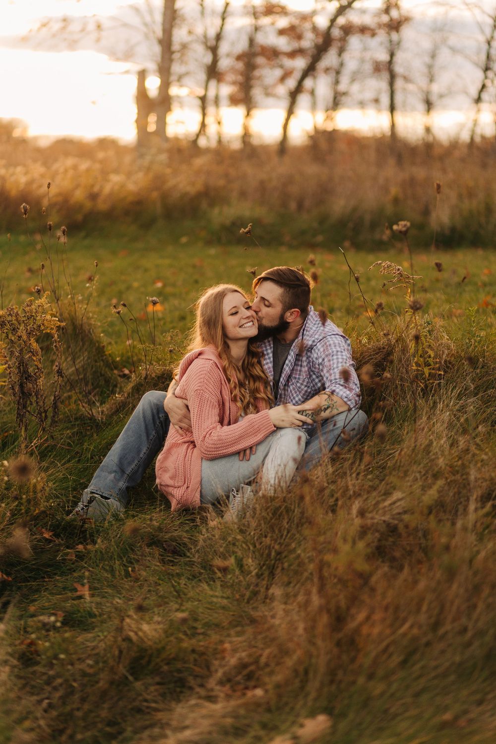 Lapeer County Michigan in Imlay City, a couples session in the grass during golden hour.