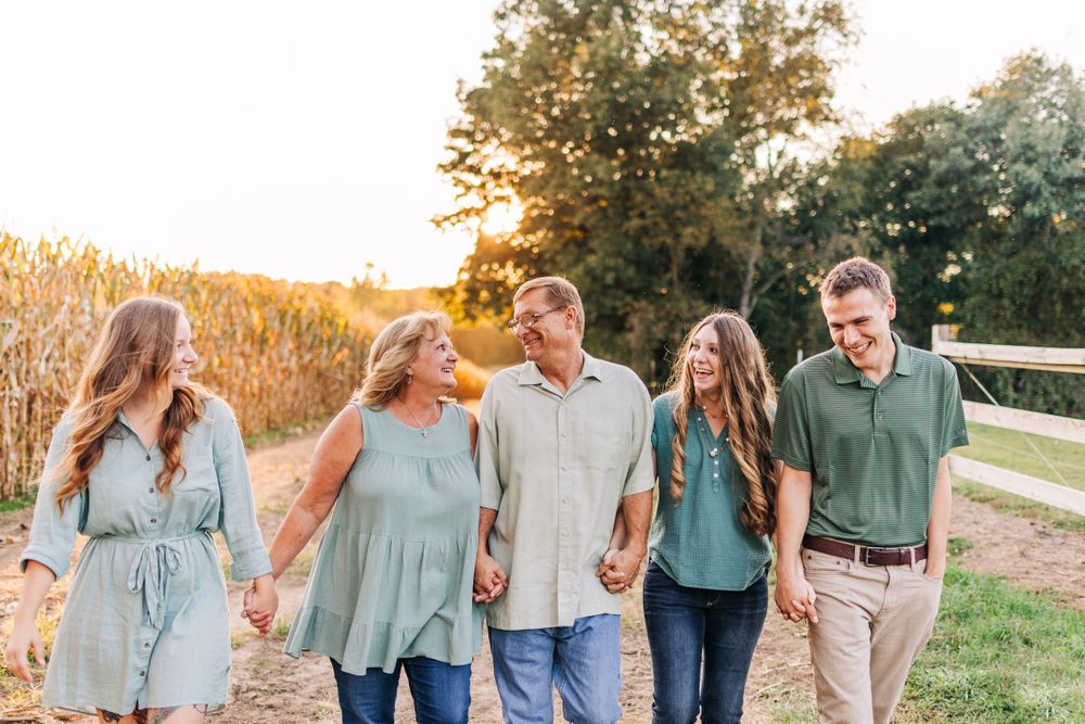 Brighton Michigan family session with grown children and pregnancy announcement. Family photographer during golden hour.