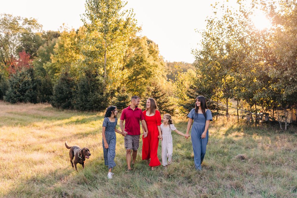 Lapeer Michigan family session during golden hour. Pets are always welcome in sessions.