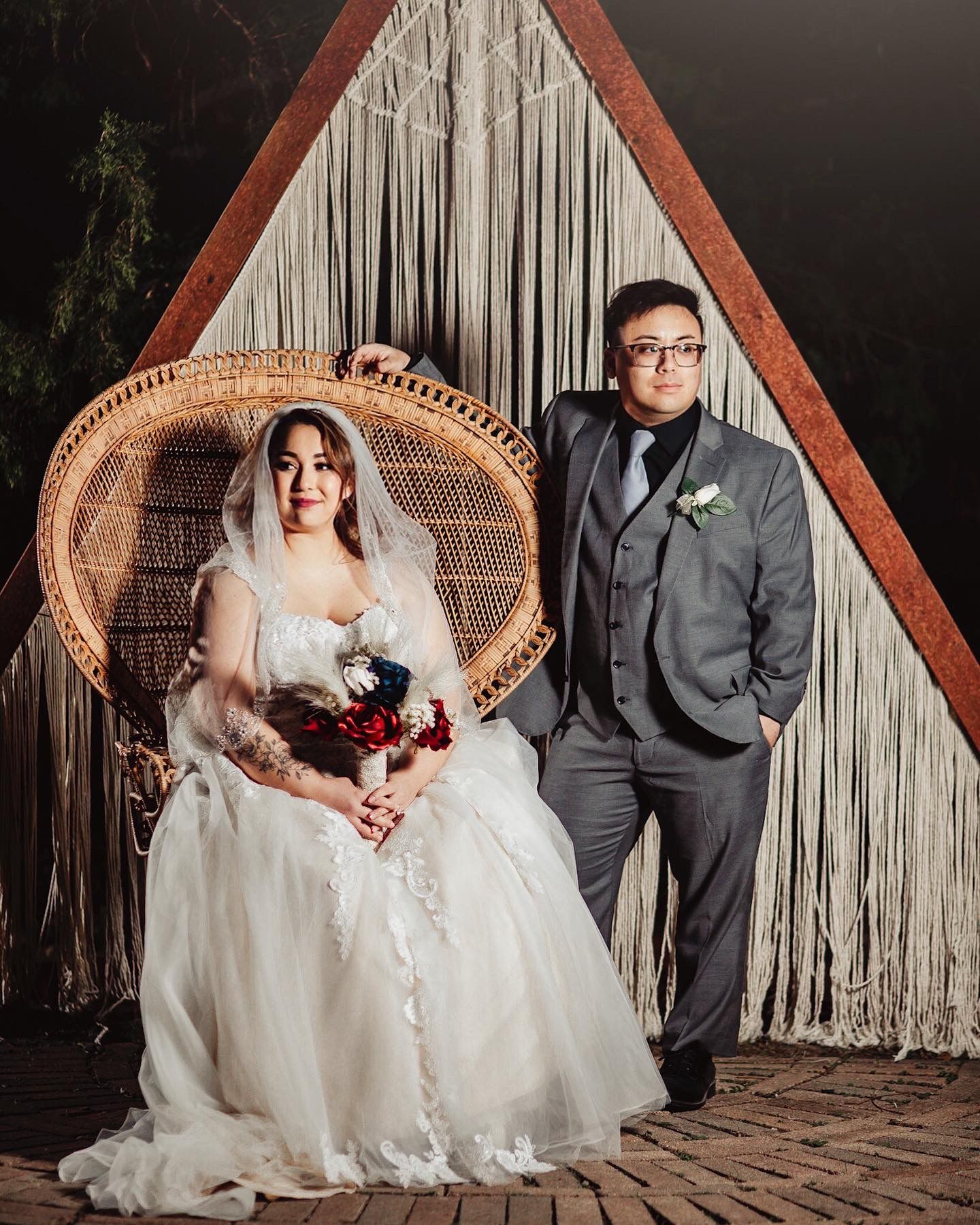 Boho Wedding with White Dress and Grey Suit With Royal Blue and Crimson Flowers at Arrowhead Weddings and Events