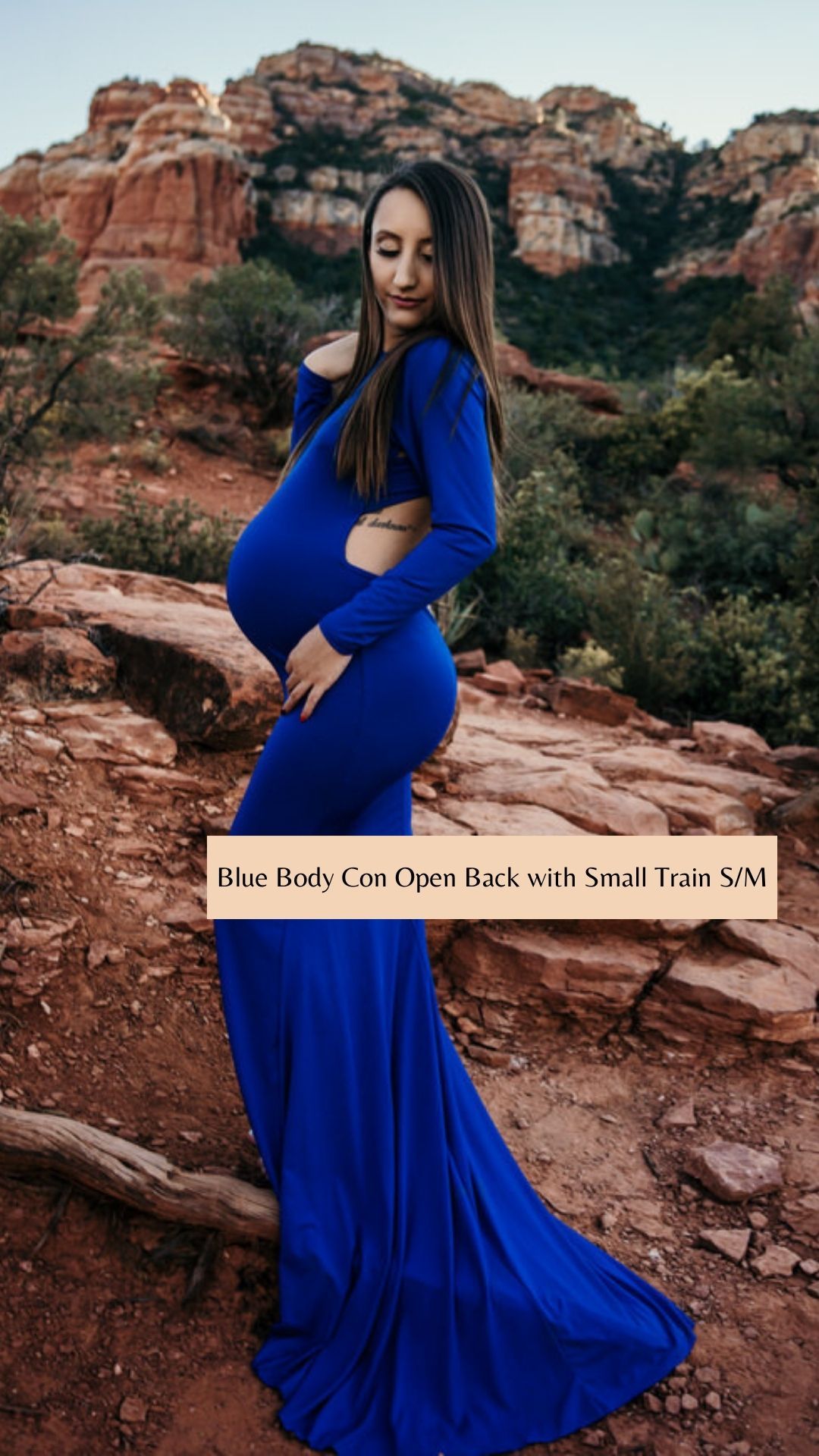 Royal blue fitted gown with train photographed against dramatic red rock formations.