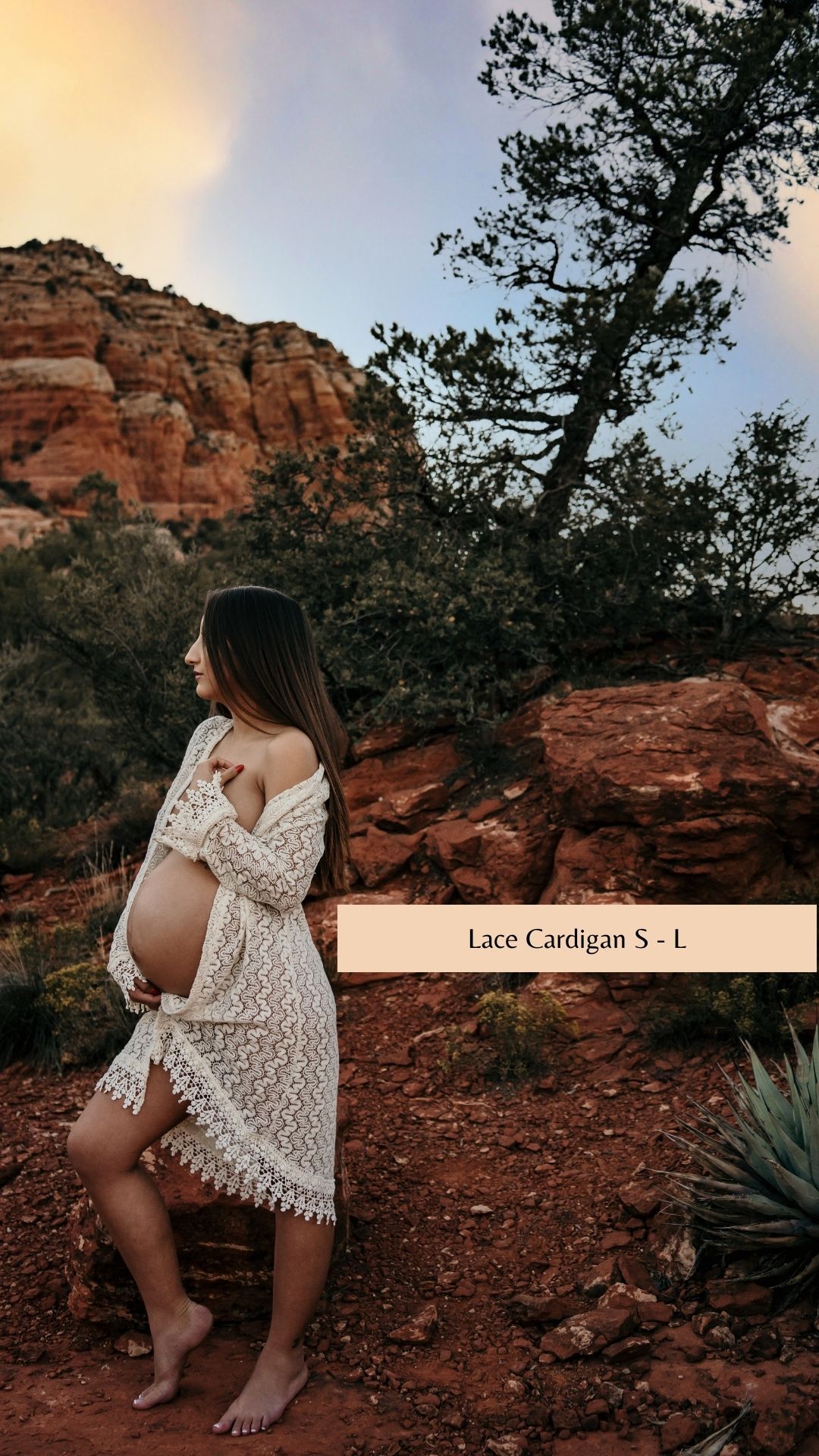 White lace cardigan styled against rustic red rock landscape.