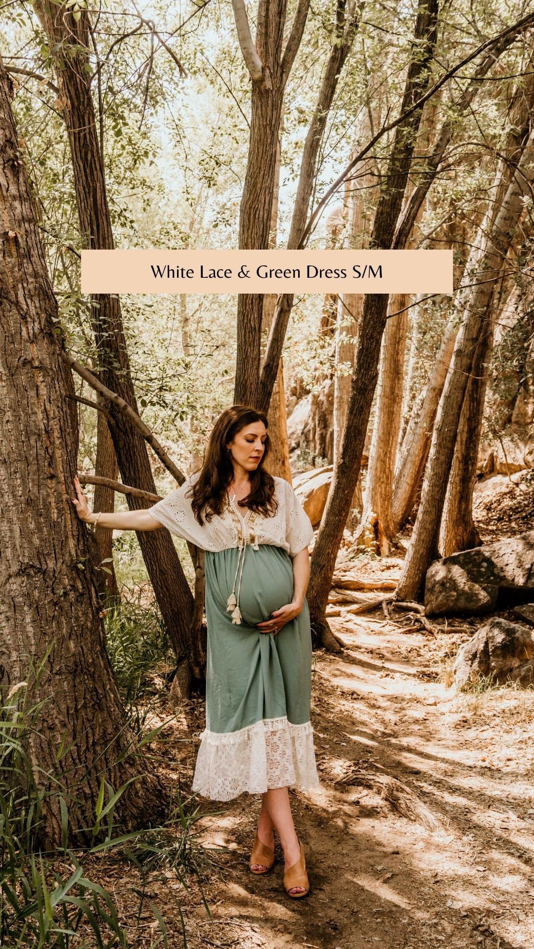 Vintage-inspired white lace and sage green dress photographed in wooded forest setting.
