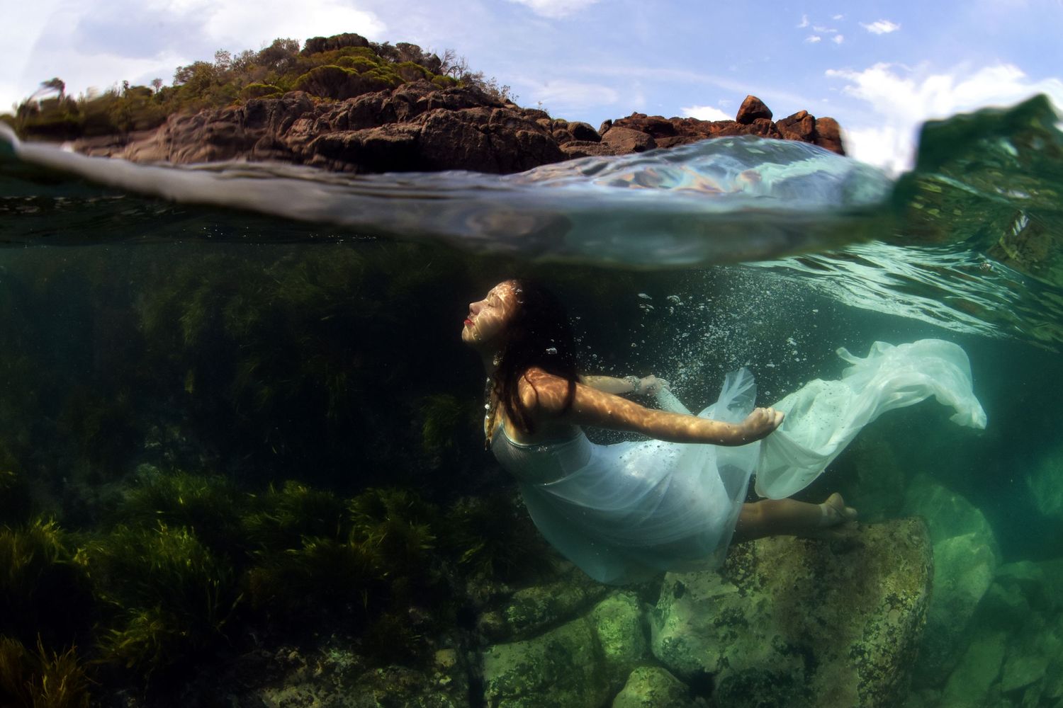 Authentic, storytelling editorial portrait underwater photography capturing real moments with depth, emotion, and a strong visual narrative