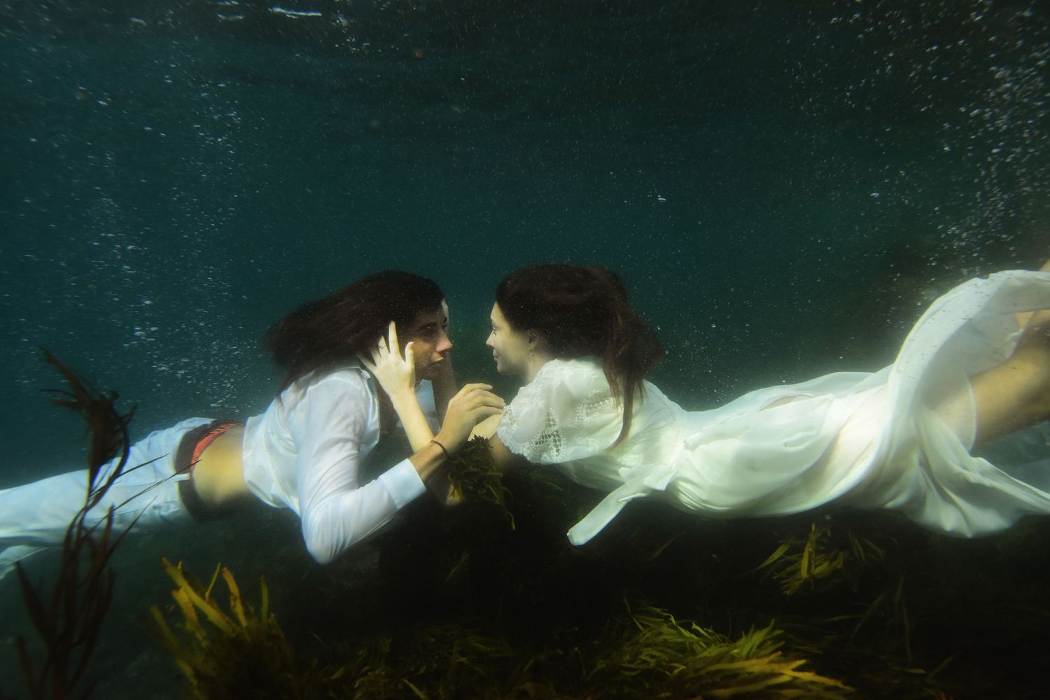 Authentic, storytelling editorial portrait underwater photography capturing real moments with depth, emotion, and a strong visual narrative