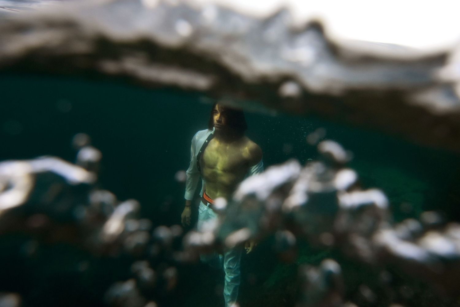 Authentic, storytelling editorial portrait underwater photography capturing real moments with depth, emotion, and a strong visual narrative