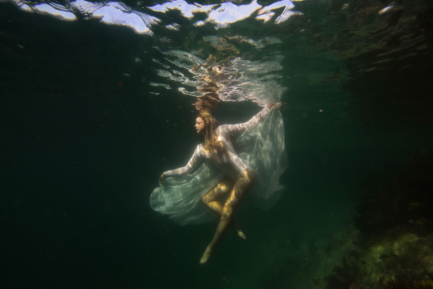 Authentic, storytelling editorial portrait underwater photography capturing real moments with depth, emotion, and a strong visual narrative