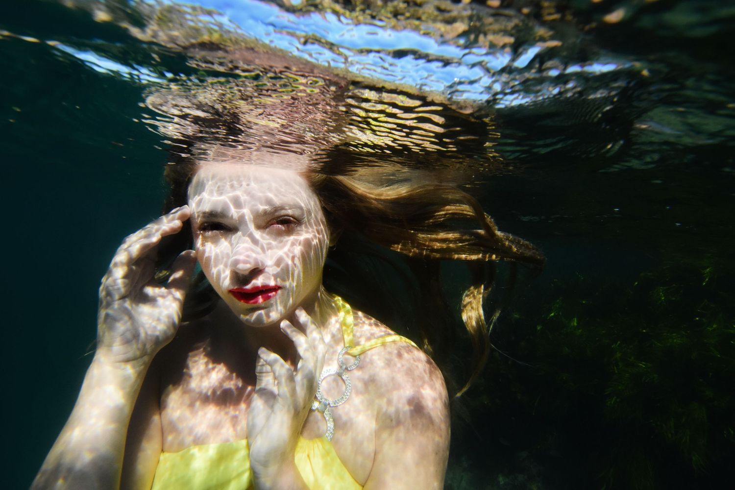 Authentic, storytelling editorial portrait underwater photography capturing real moments with depth, emotion, and a strong visual narrative