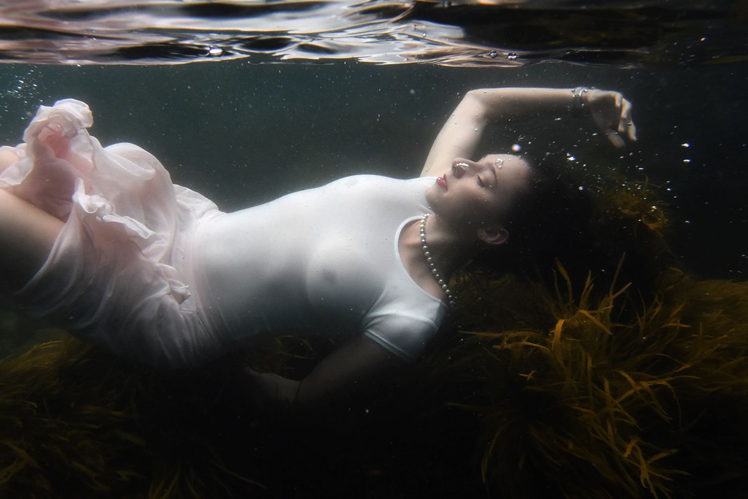 Authentic, storytelling editorial family underwater photography capturing real moments with depth, emotion, and a strong visual narrative