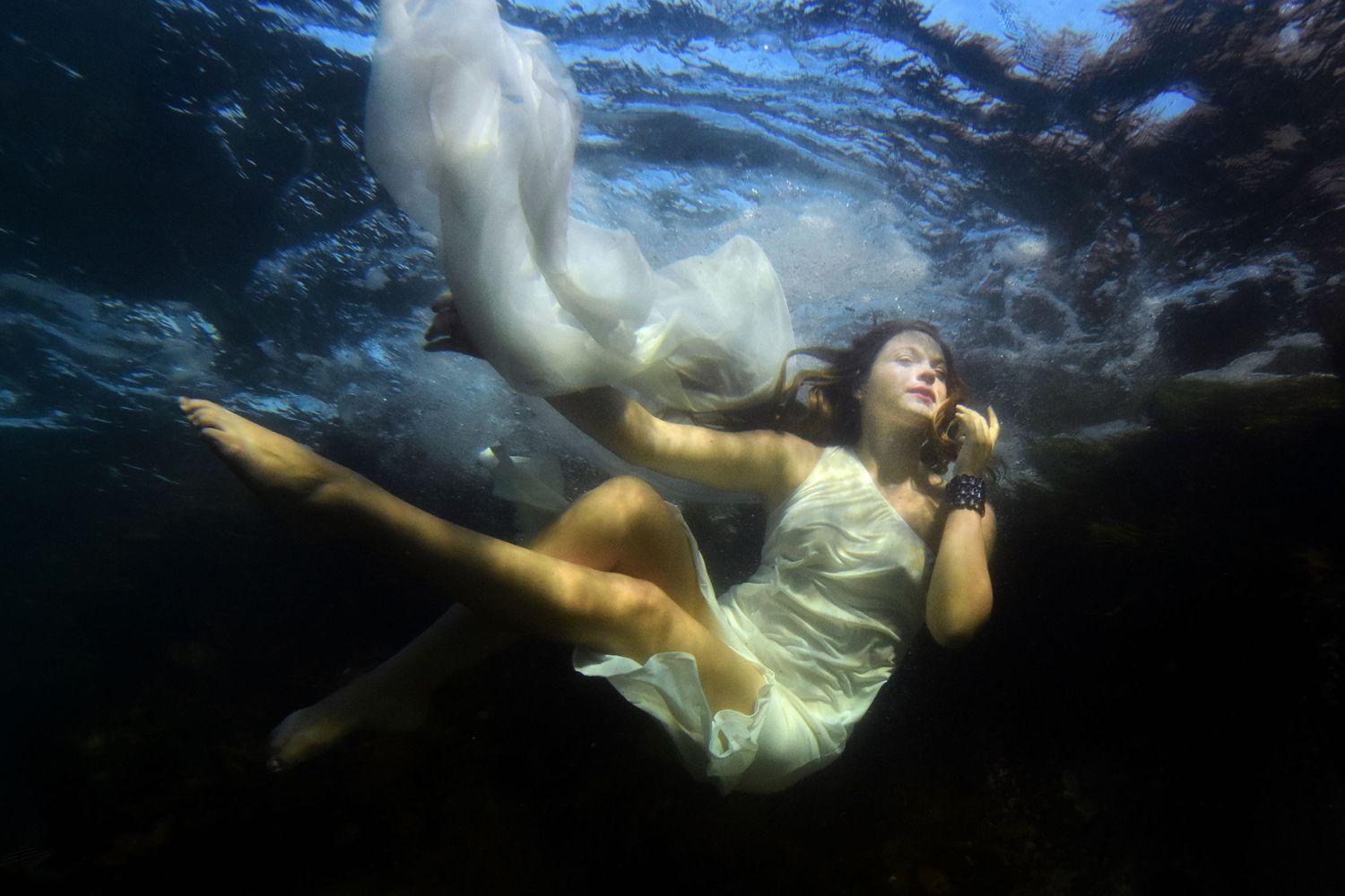 Authentic, storytelling editorial portrait underwater photography capturing real moments with depth, emotion, and a strong visual narrative