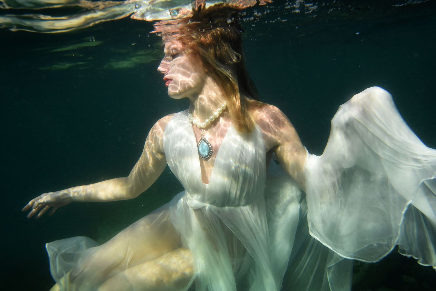 Authentic, storytelling editorial portrait underwater photography capturing real moments with depth, emotion, and a strong visual narrative