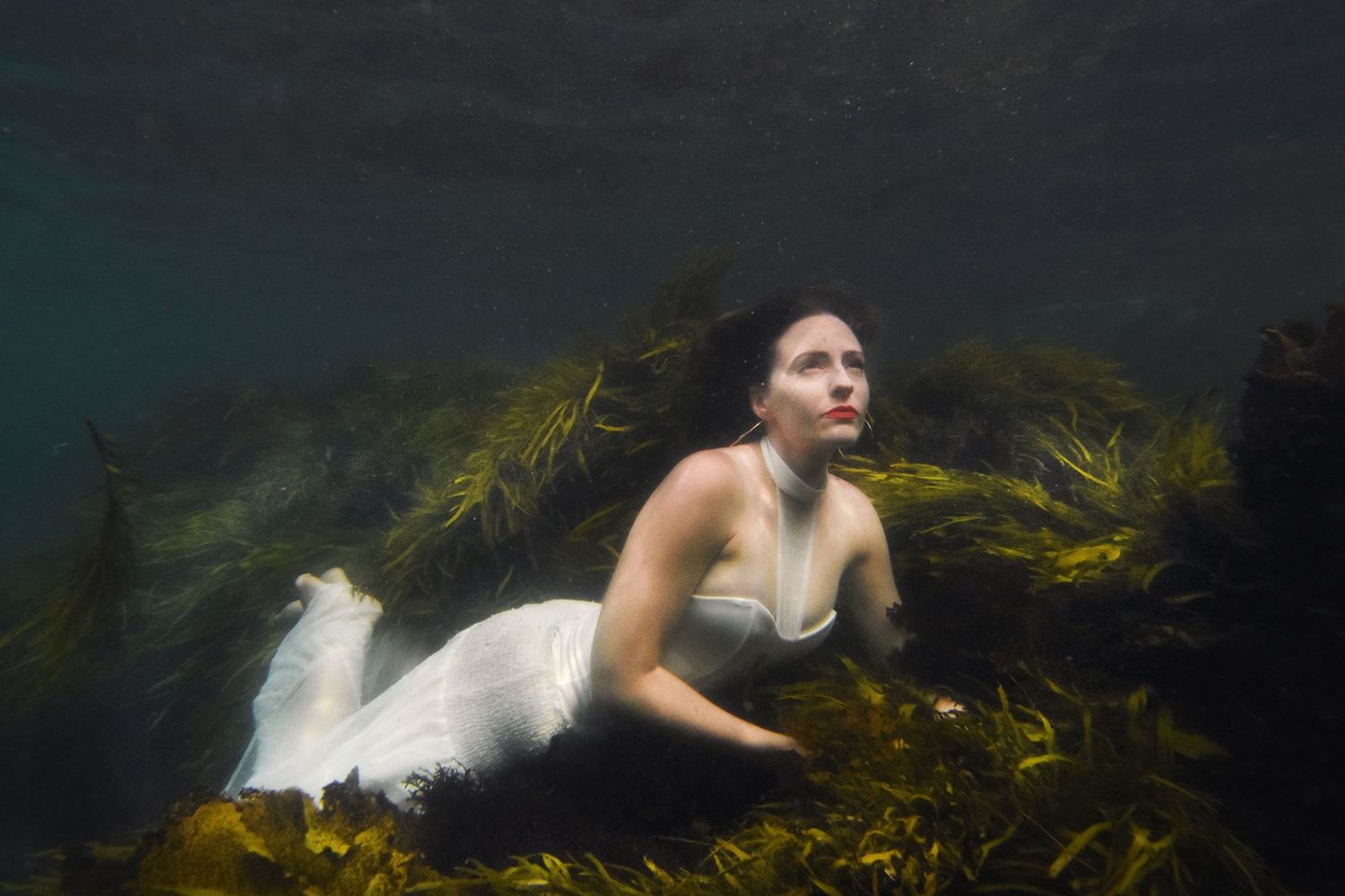 Authentic, storytelling editorial portrait underwater photography capturing real moments with depth, emotion, and a strong visual narrative