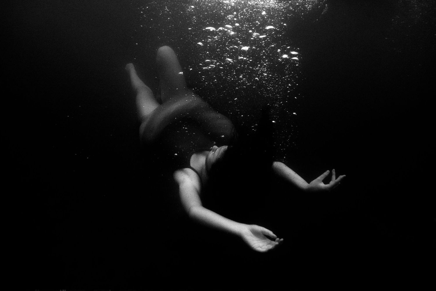 Authentic, storytelling editorial portrait underwater photography capturing real moments with depth, emotion, and a strong visual narrative