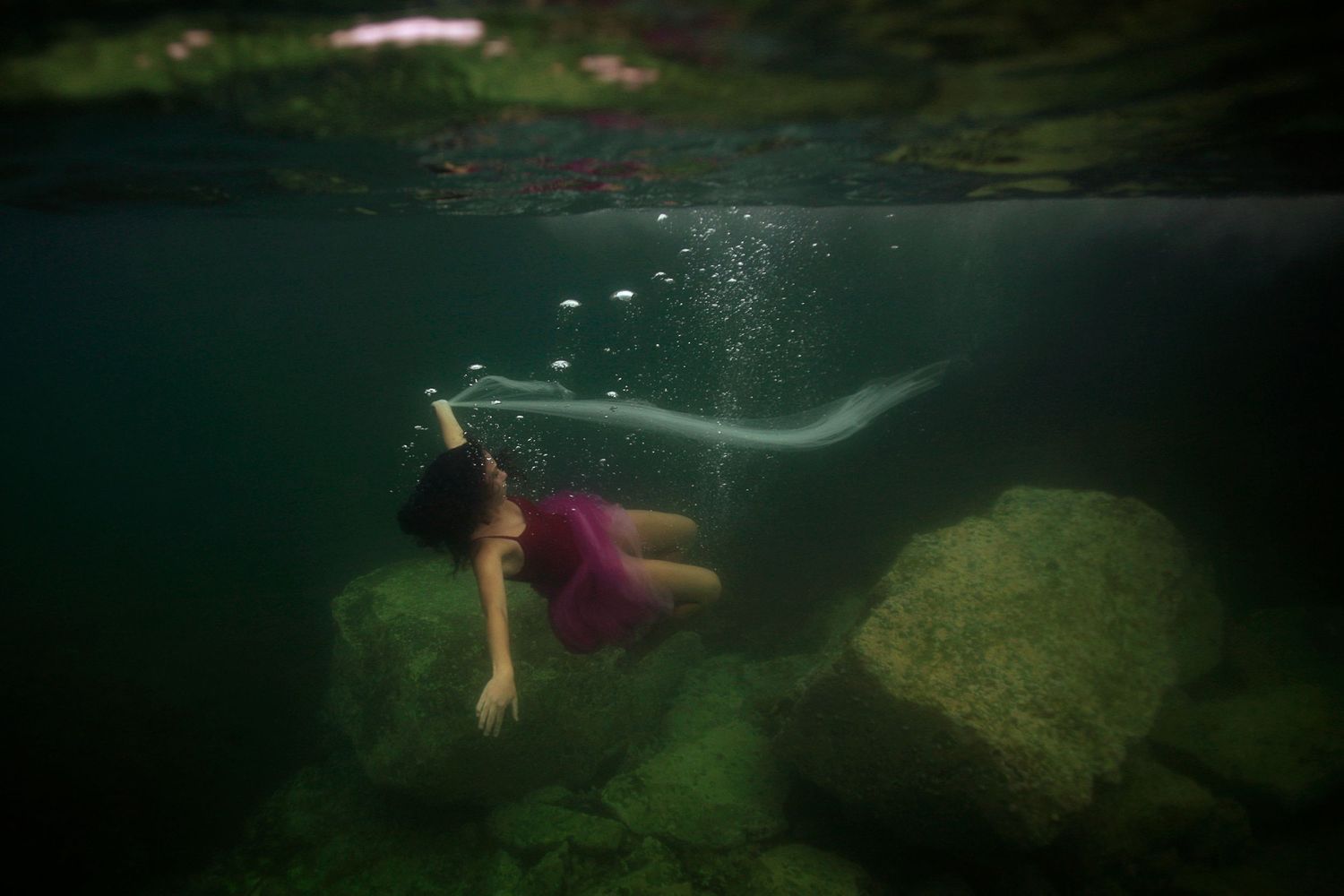 Authentic, storytelling editorial family underwater photography capturing real moments with depth, emotion, and a strong visual narrative