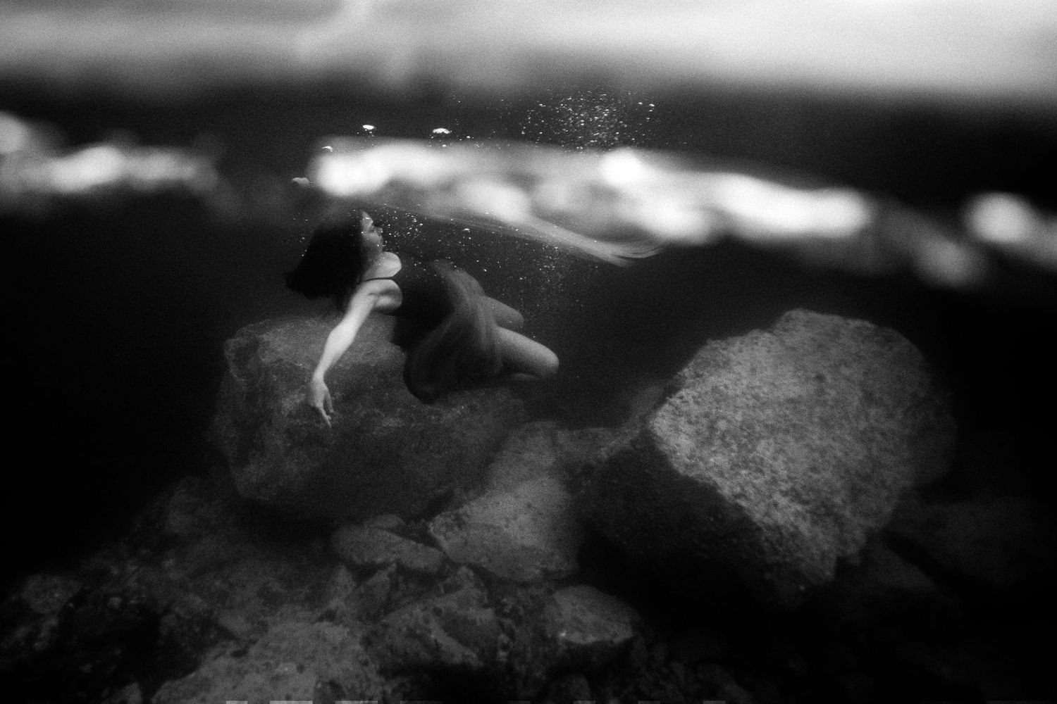 Authentic, storytelling editorial portrait underwater photography capturing real moments with depth, emotion, and a strong visual narrative