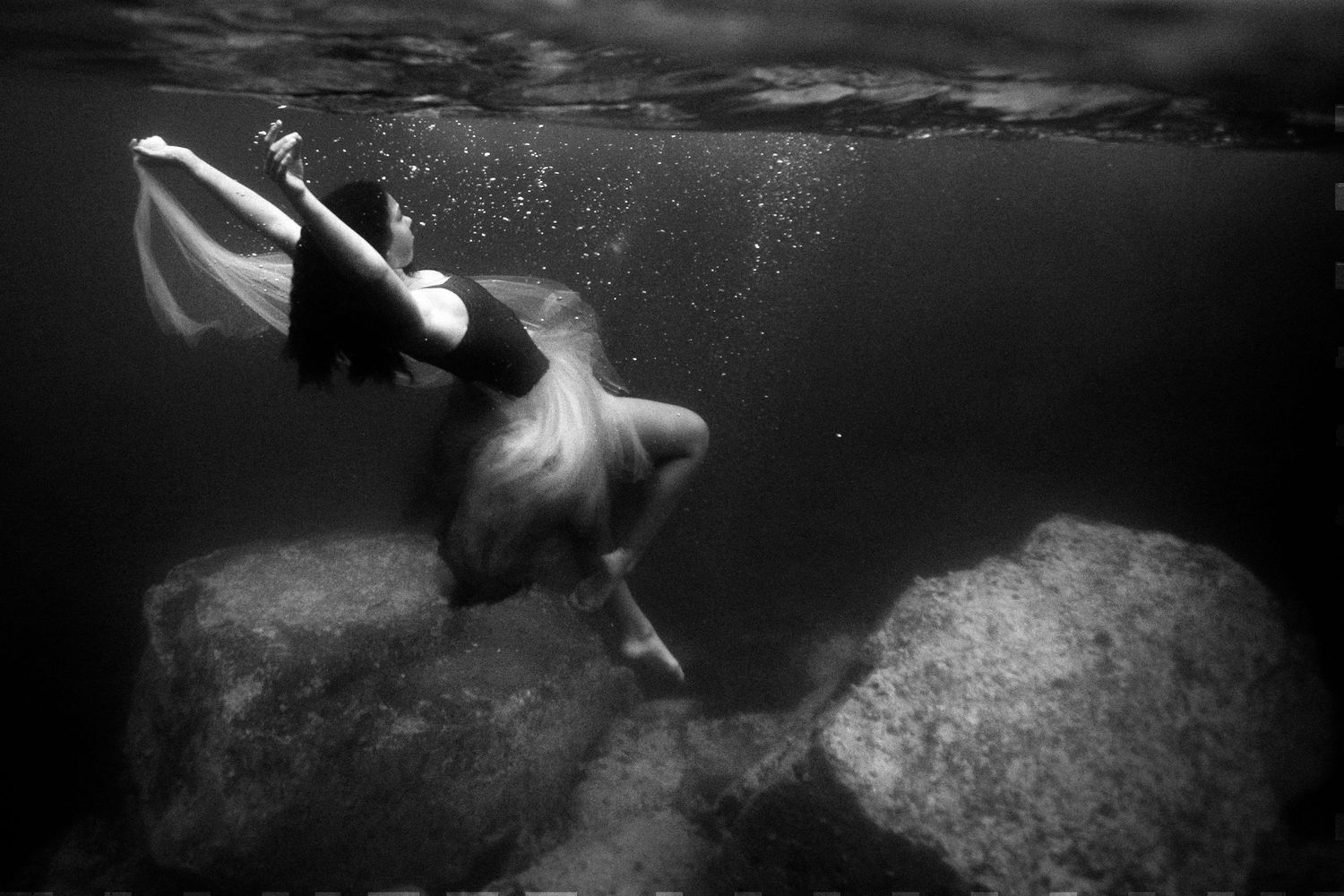 Authentic, storytelling editorial portrait underwater photography capturing real moments with depth, emotion, and a strong visual narrative