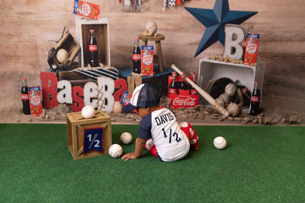 Baseball themed party decor with vintage boxes, sports equipment and Coca-Cola bottles.