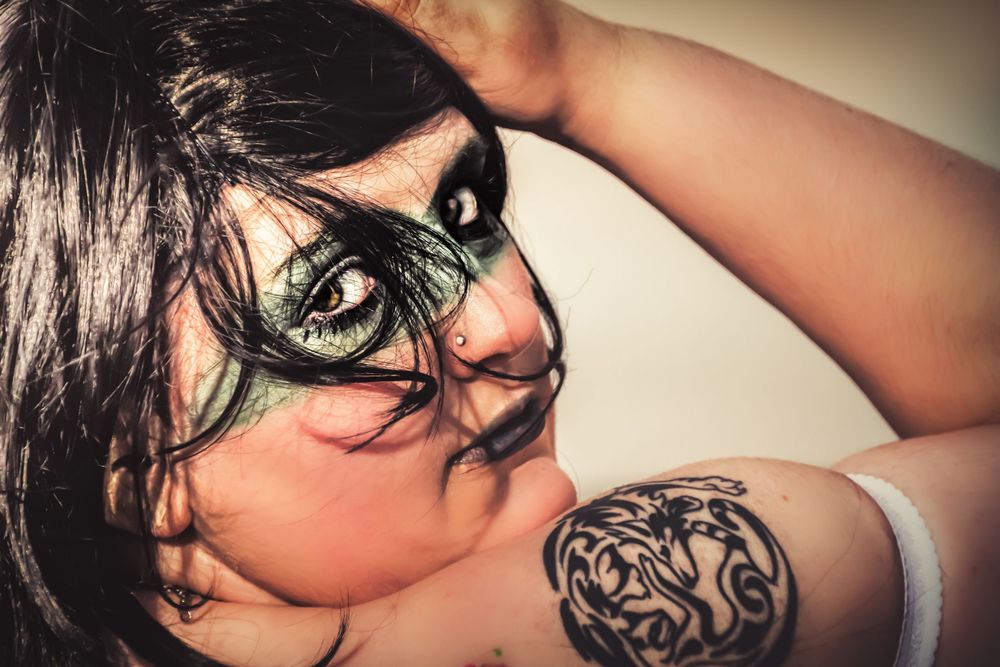 A series of artistic close-up portraits showcasing dramatic angles and lighting effects.