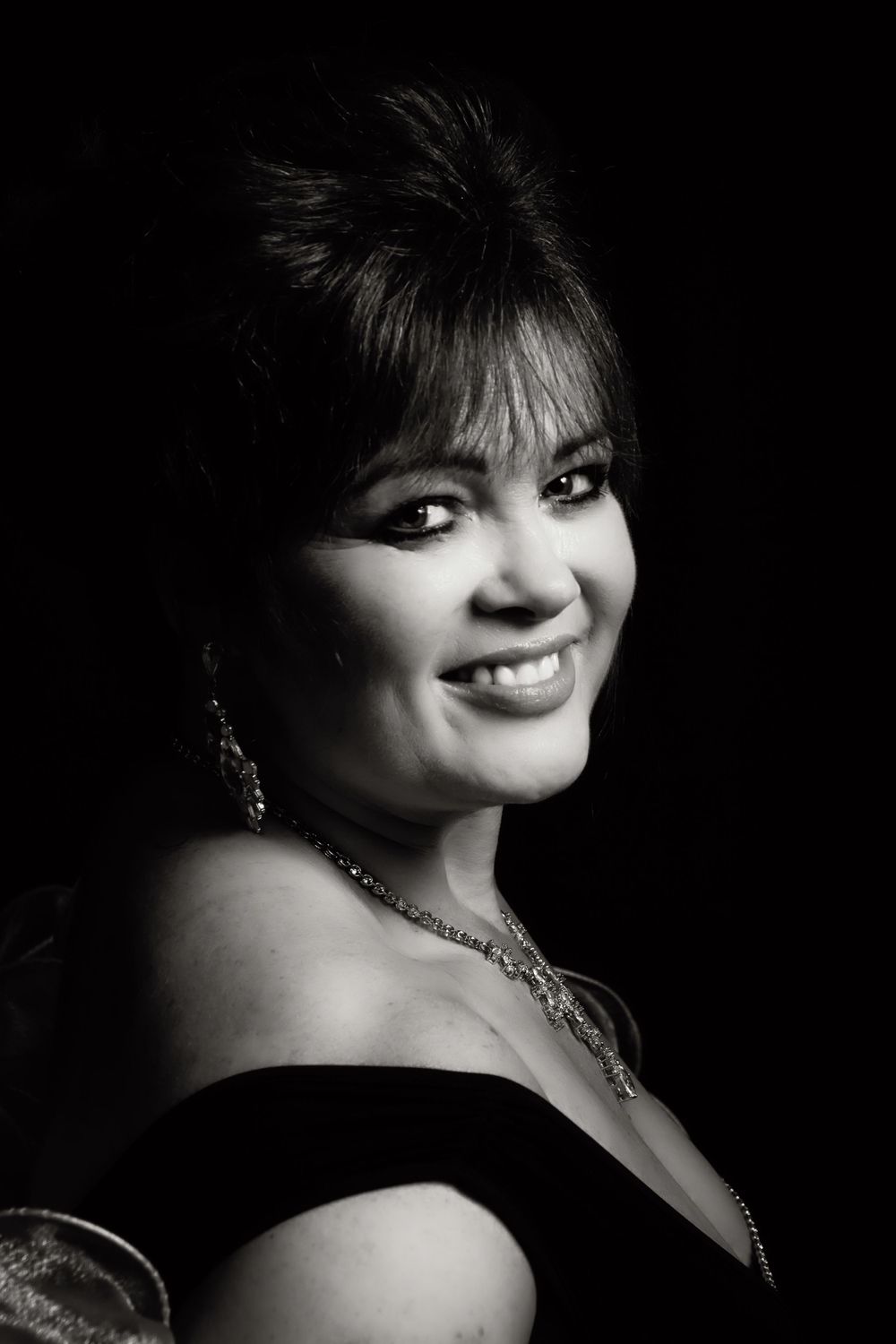 A dramatic black and white portrait series showing different angles and expressions.