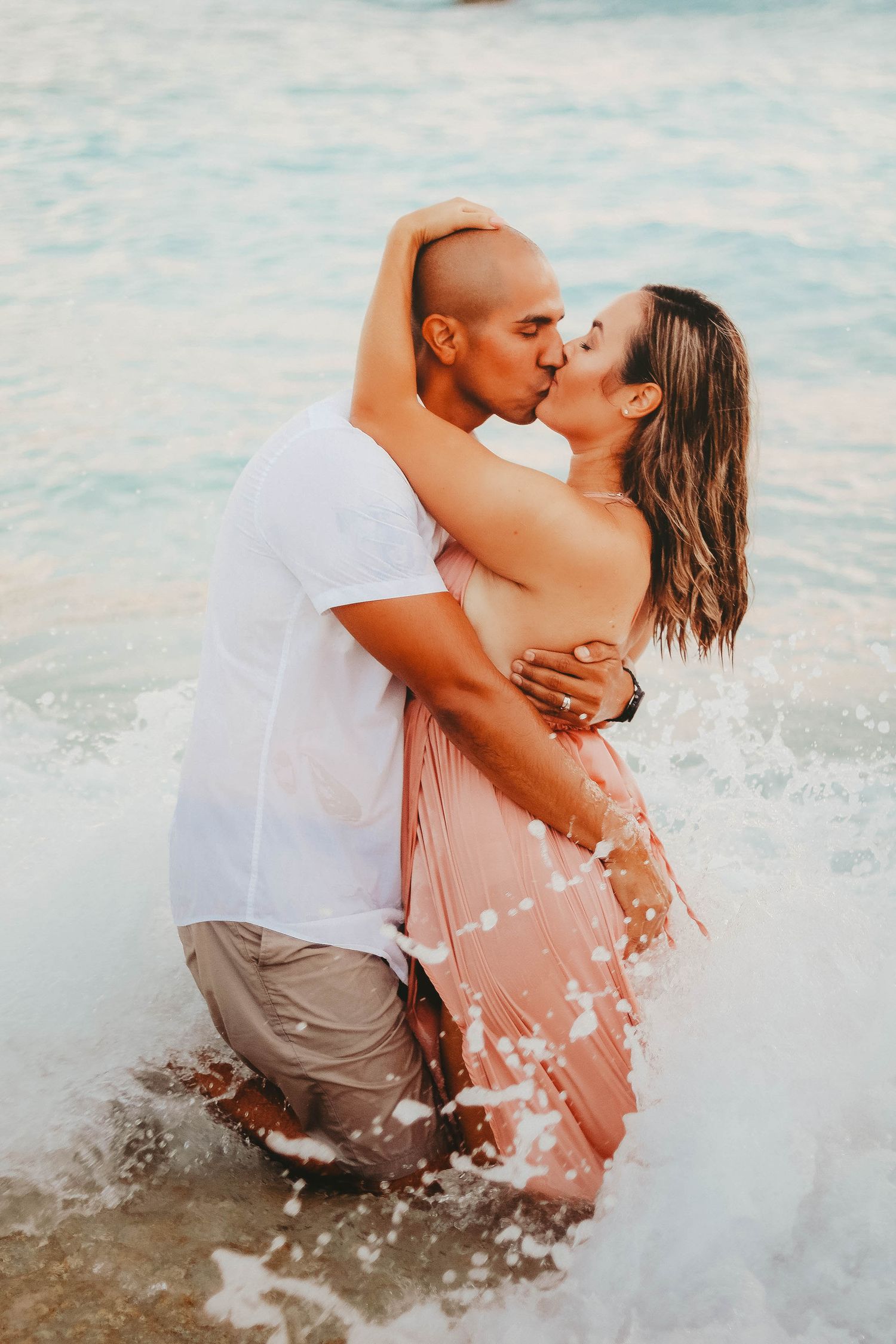 mermaids grotto okinawa japan waves splashing couple photoshoot
