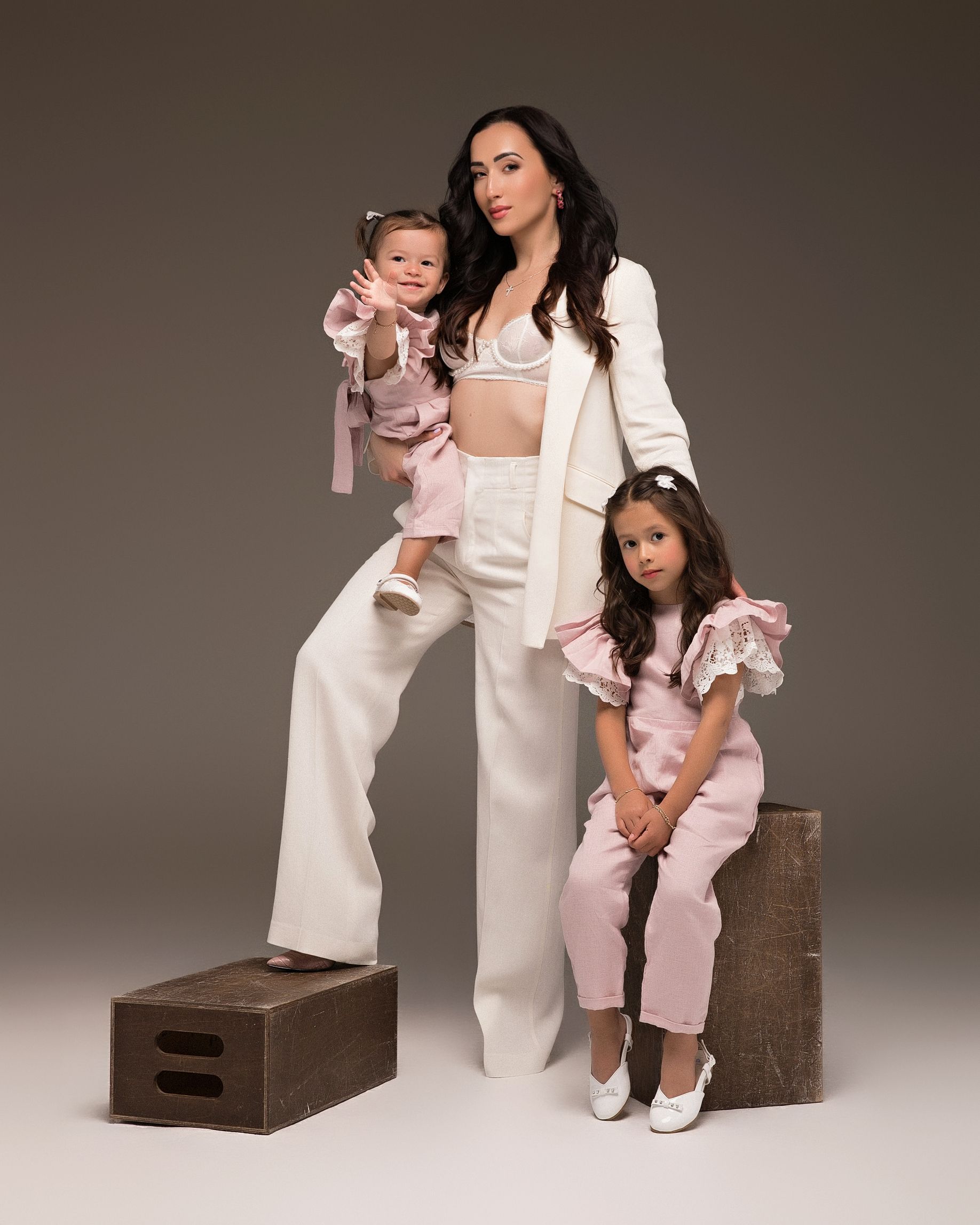 San Diego studio Mommy and Me photoshoot with a pink and gray theme, captured by Daryana Orange.