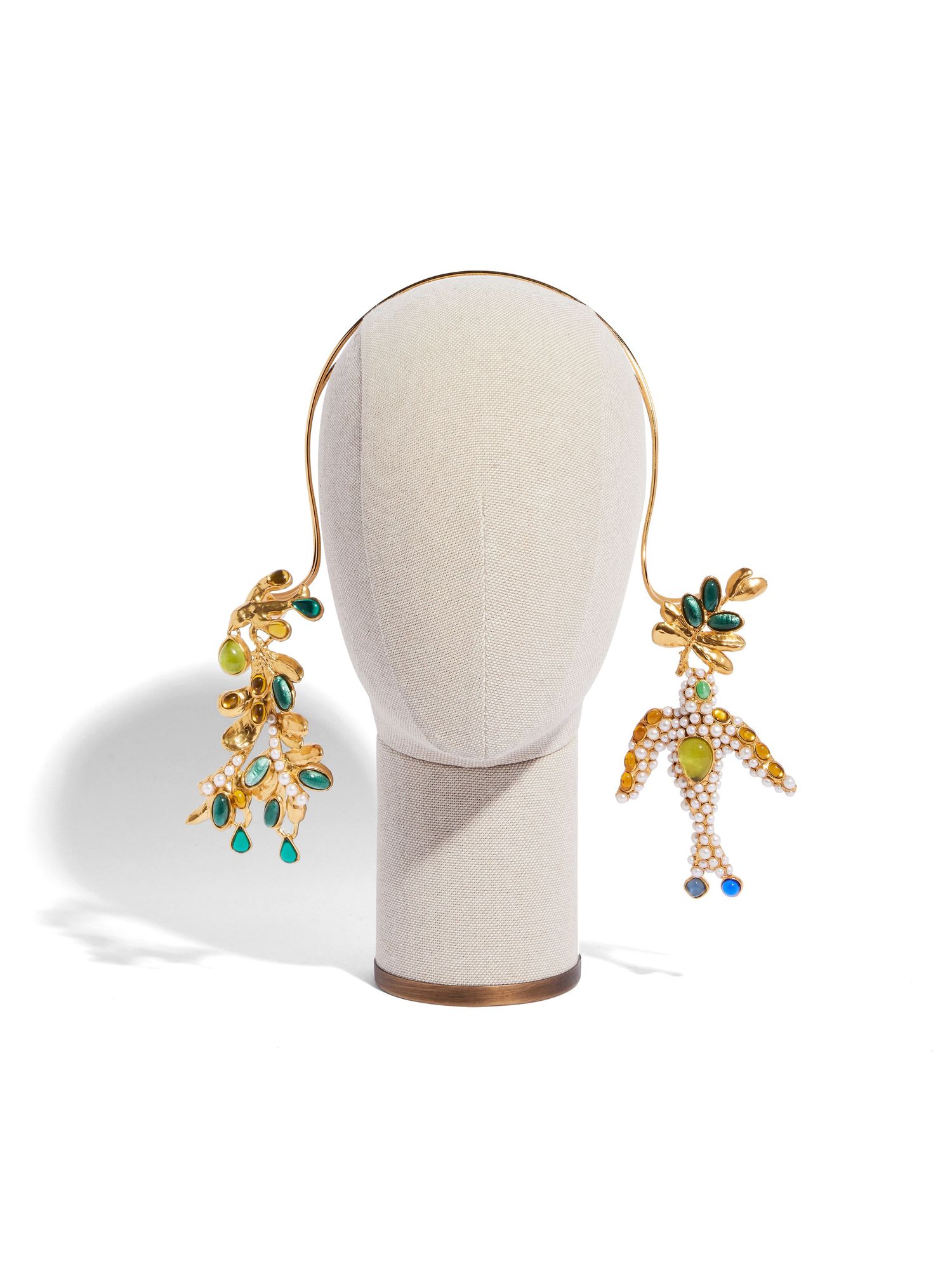 Decorative earrings featuring colorful gemstones in whimsical dancing figure designs.
