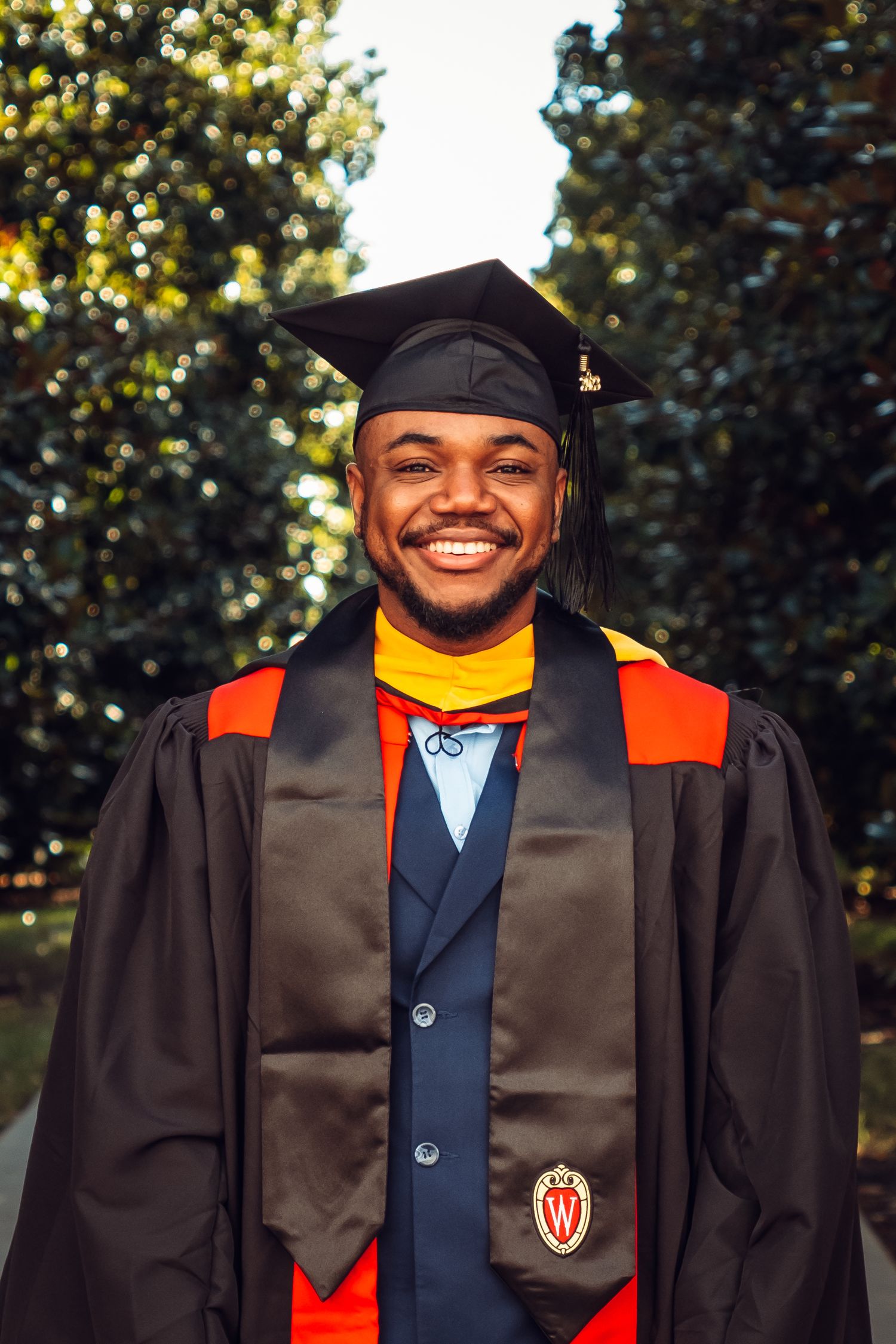 Close-up portrait of a Dallas College Graduate taken by Eric Aaberg Photography.