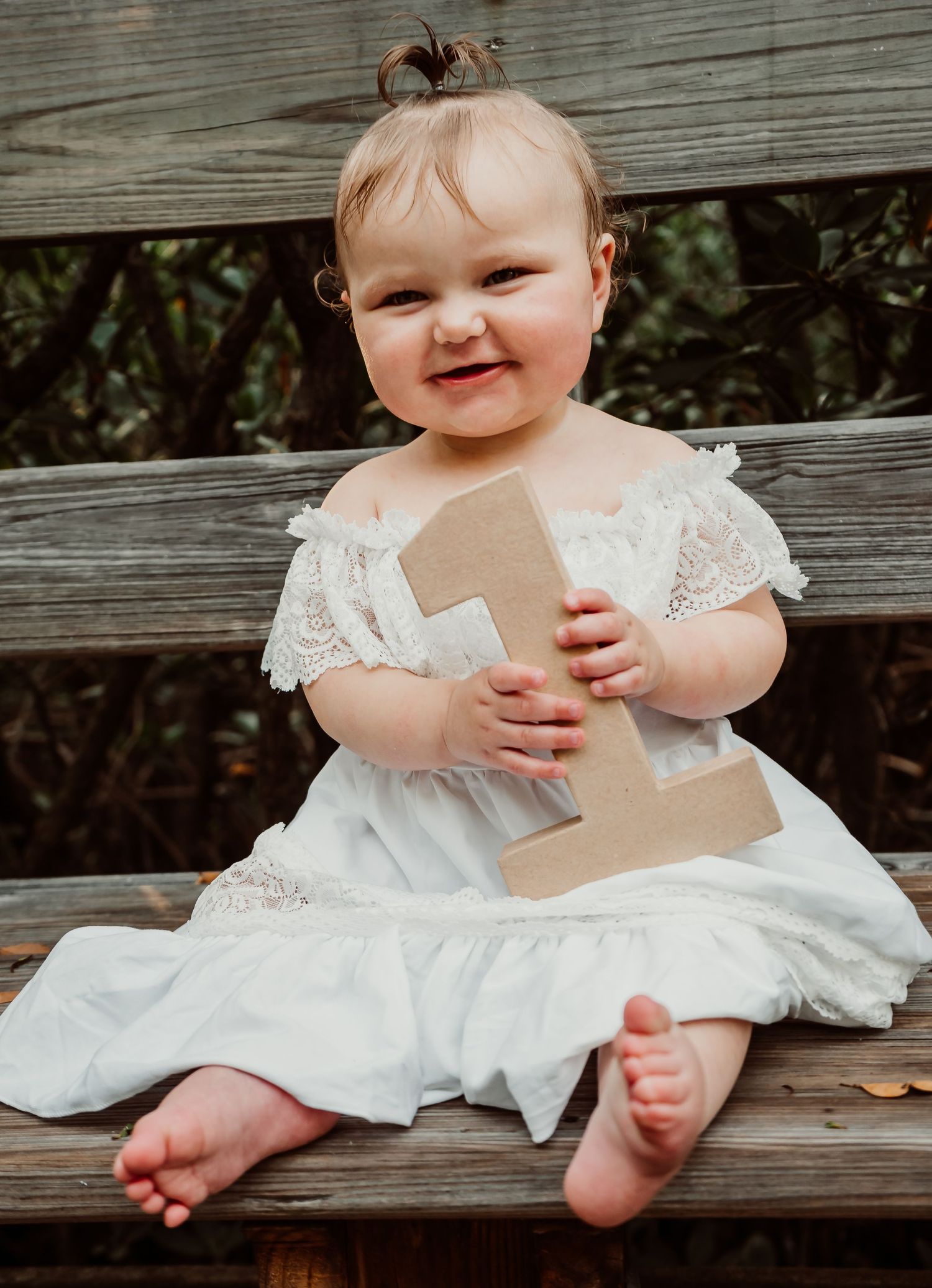 Outdoor Cake Smash Session at Indian Rocks Beach, Indian Rocks, FL; Baby holding a 1 sign