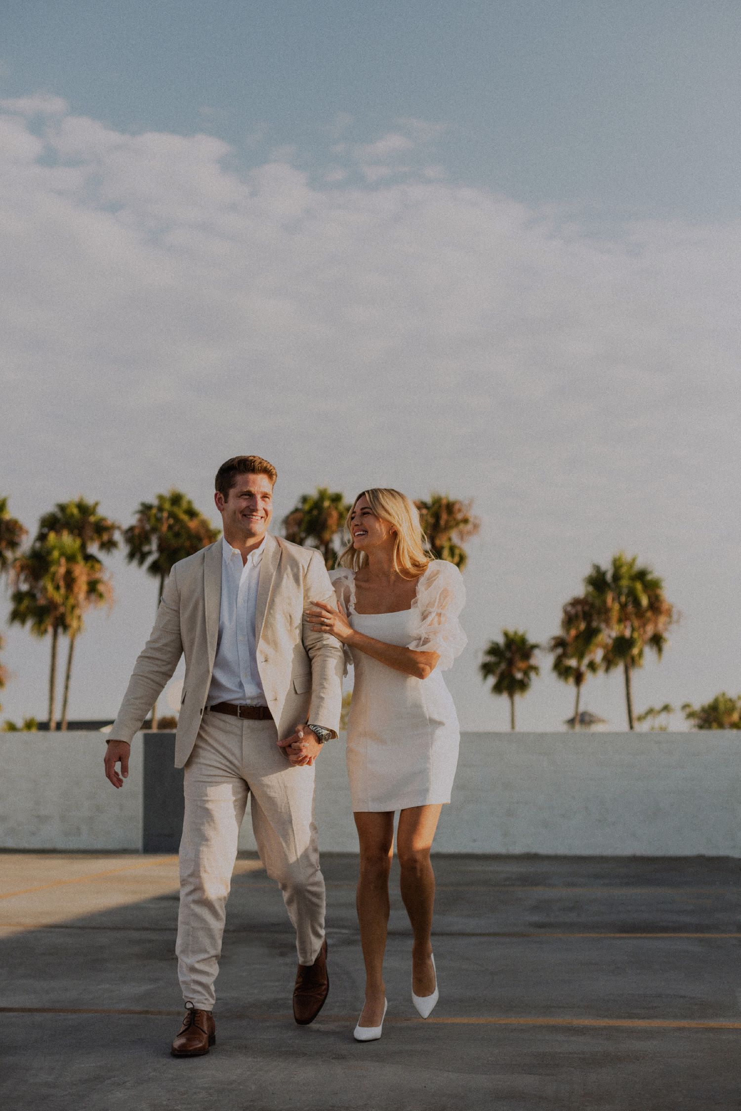 35mm film photo of fun bridal themed engagement shoot on roof of parking structure in Lido Marina, Newport beach