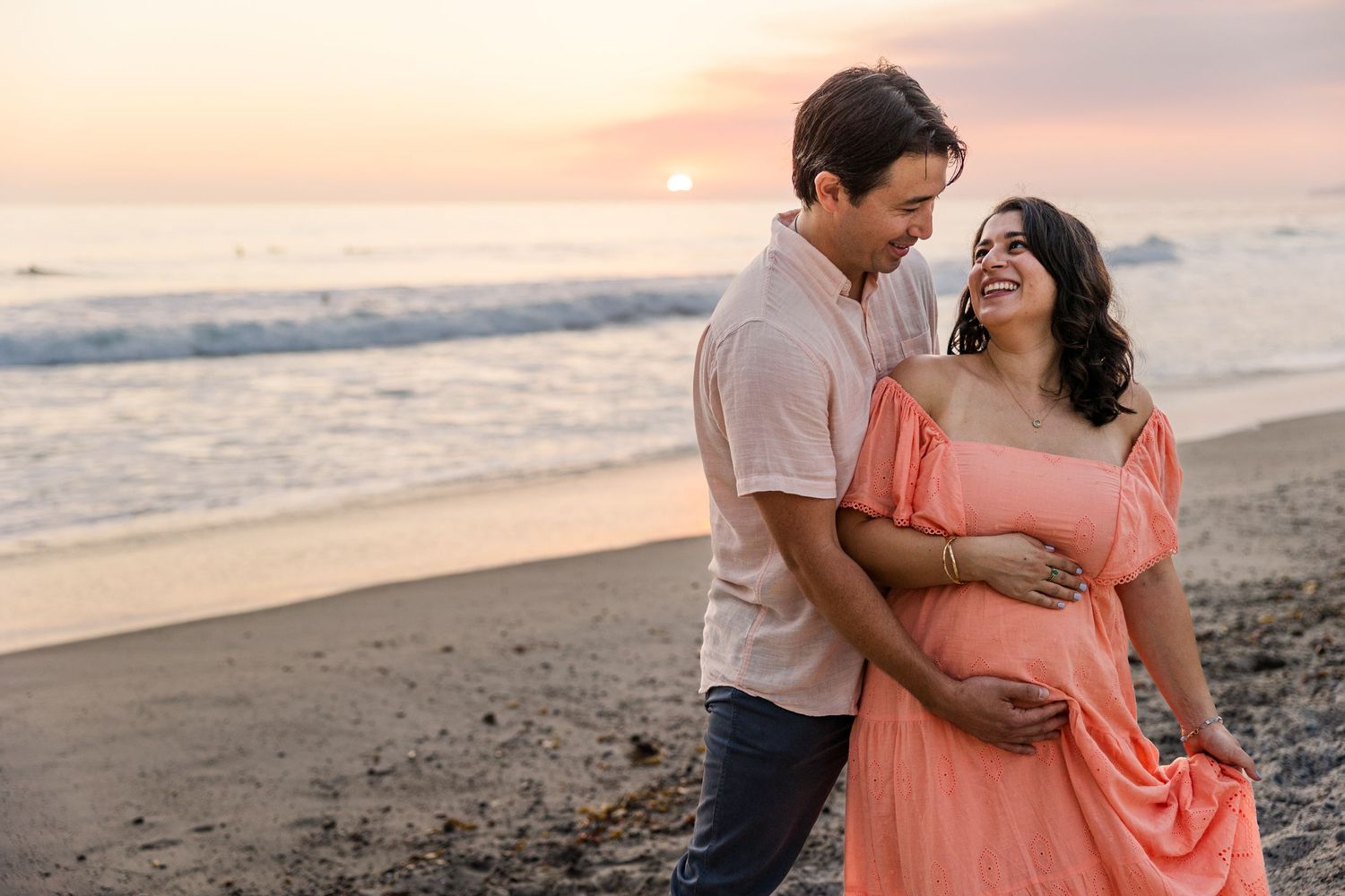 Golden hour maternity session at the beach in San Clemente