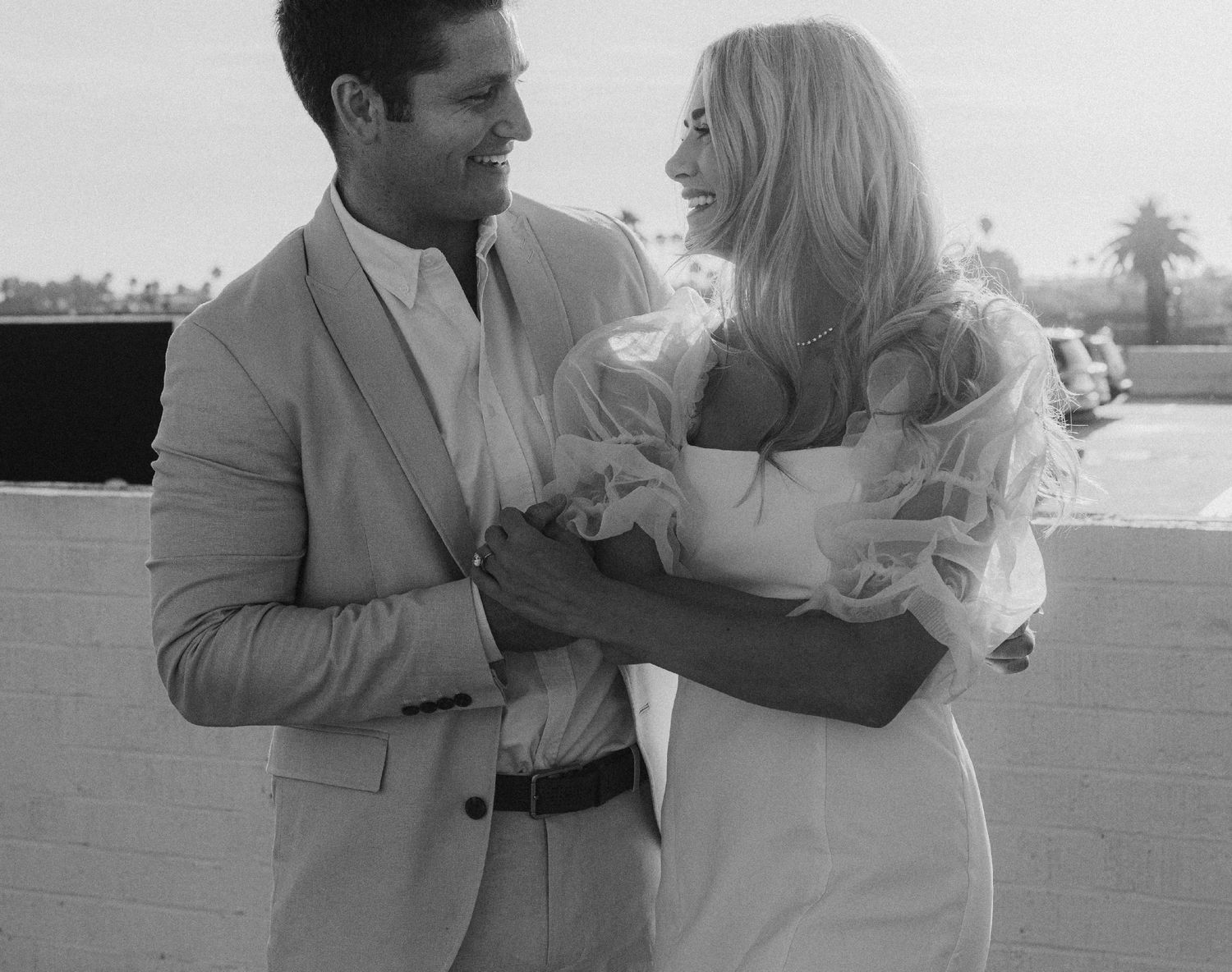 35mm film photo of fun bridal themed engagement shoot on roof of parking structure in Lido Marina, Newport beach
