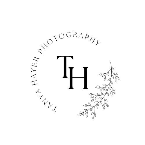 Decorative floral and leaf design elements arranged in a circular pattern.