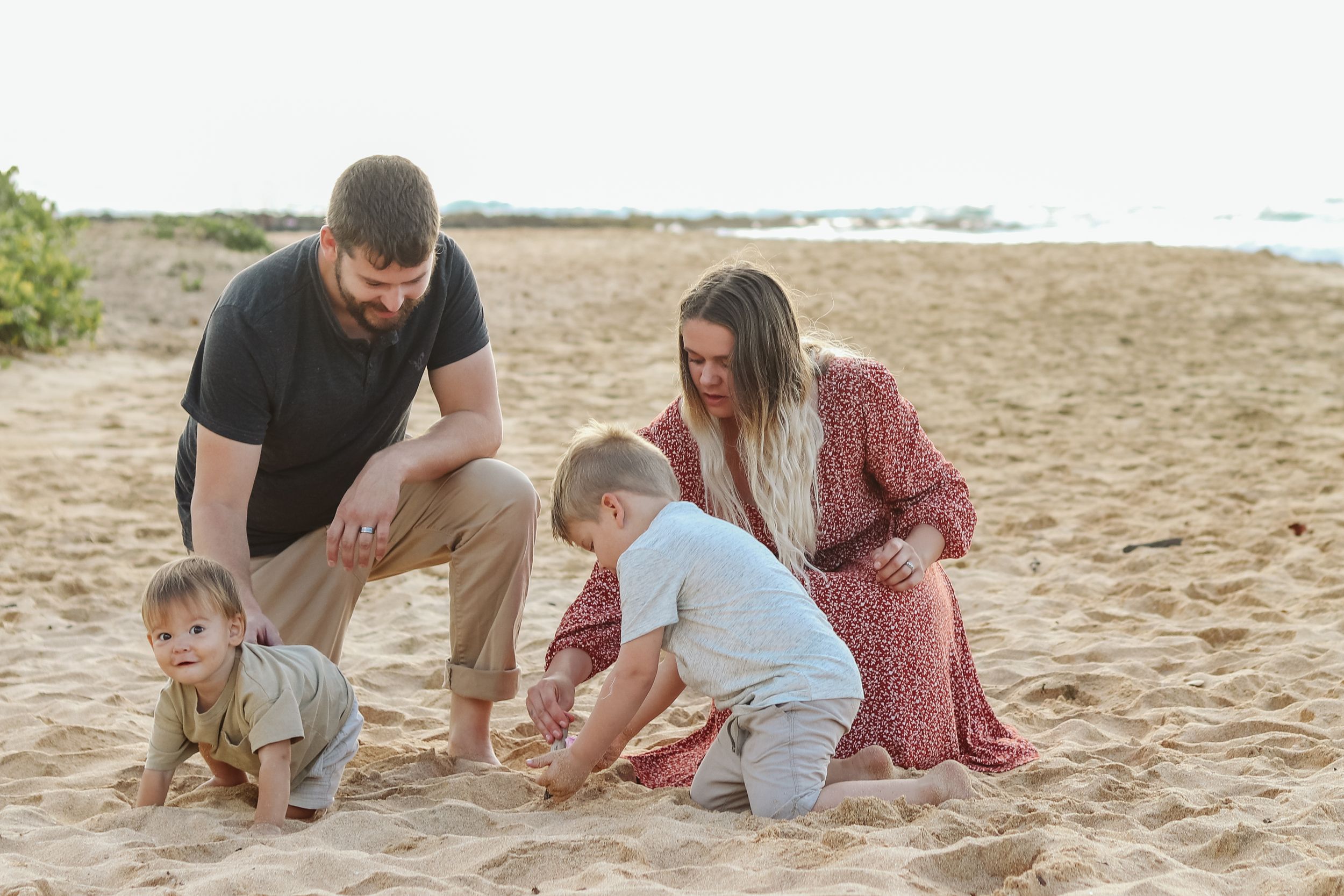 Candid moments of family bonding and playing in the sand at the beach.