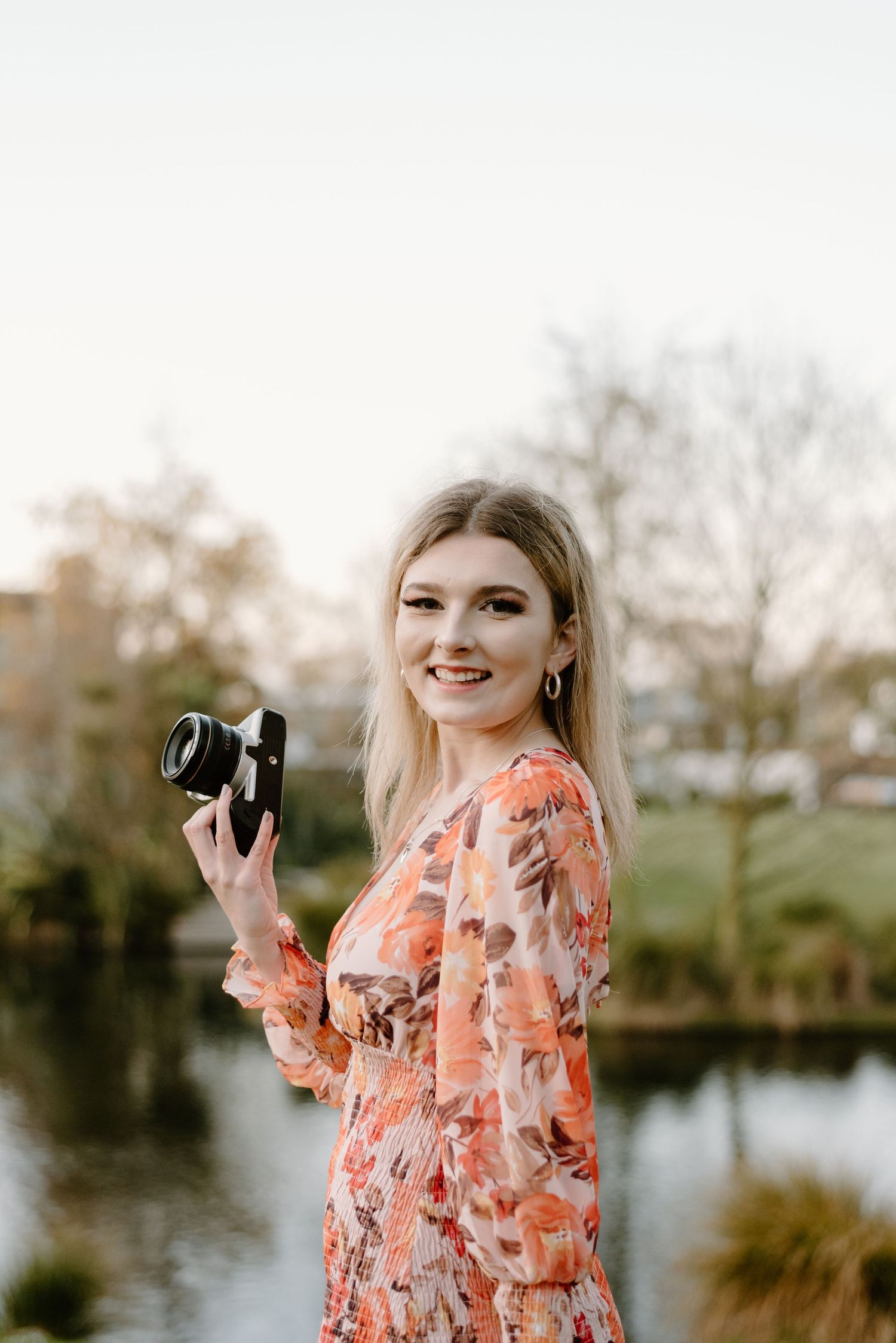 Lavender Turner the photographer holding a camera headshot