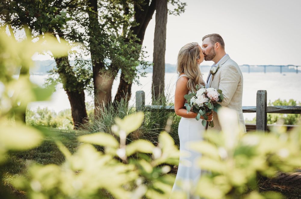 A romantic wedding photo sequence captured outdoors with trees and natural lighting in the background. Annapolis wedding photographer