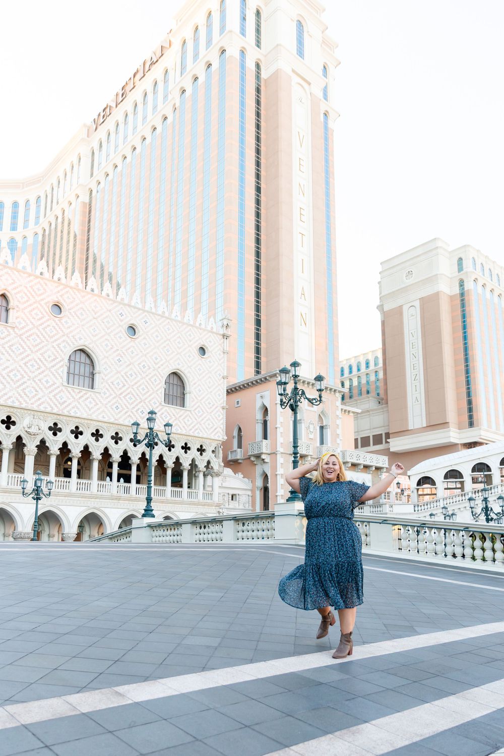 Elegant twirl photographed against The Venetian's distinctive Gothic-inspired architecture and lamp posts.