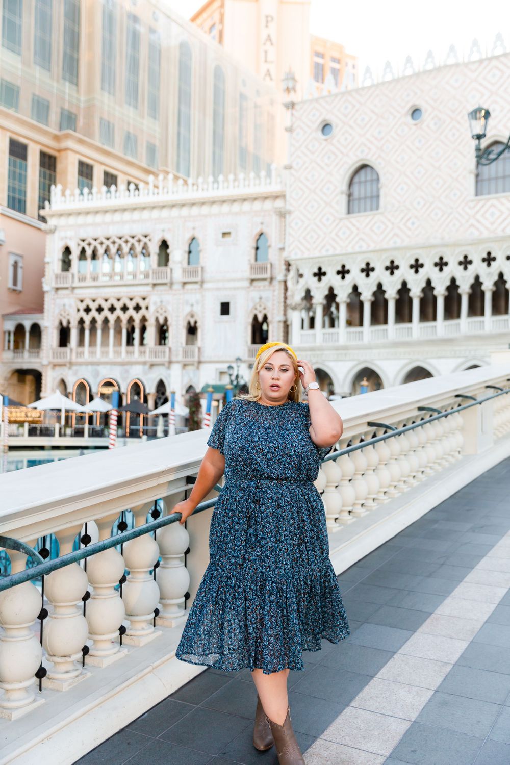 A fashionable blue dress contrasts beautifully against the Italian-inspired architecture of The Venetian hotel.