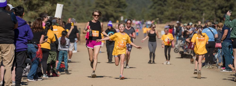Runner looks like she is flying with her arms out.