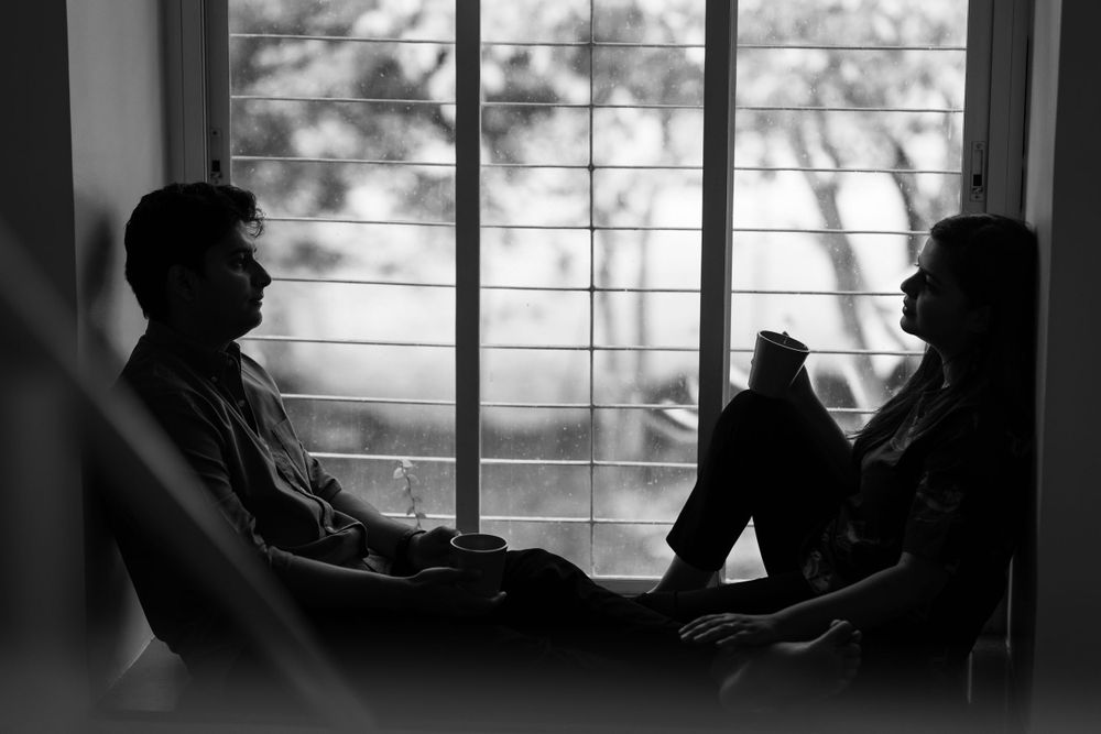 A couple enjoying a quiet moment with their coffee.
