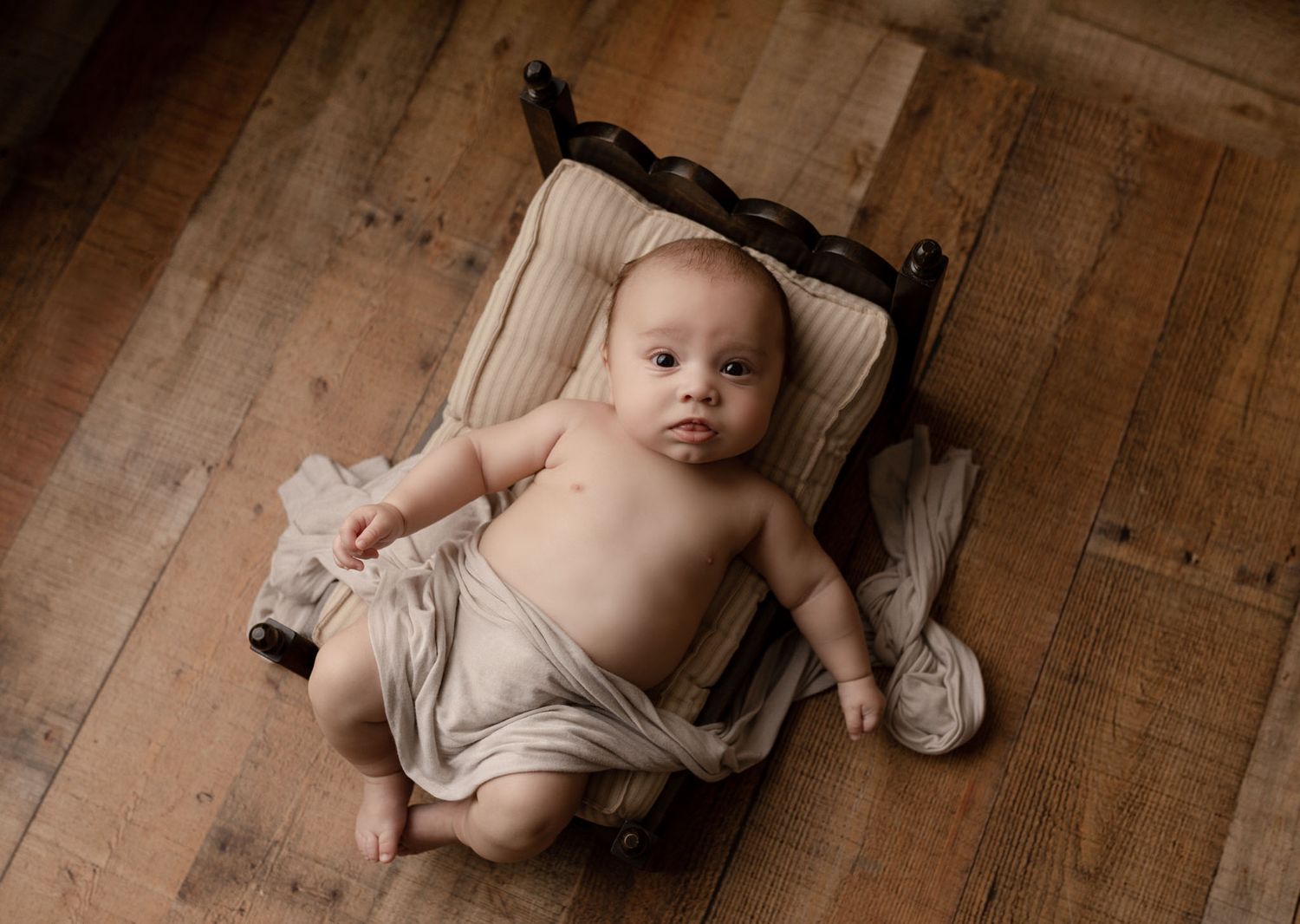 baby-boy-laying-on-bed-lake-forest-california