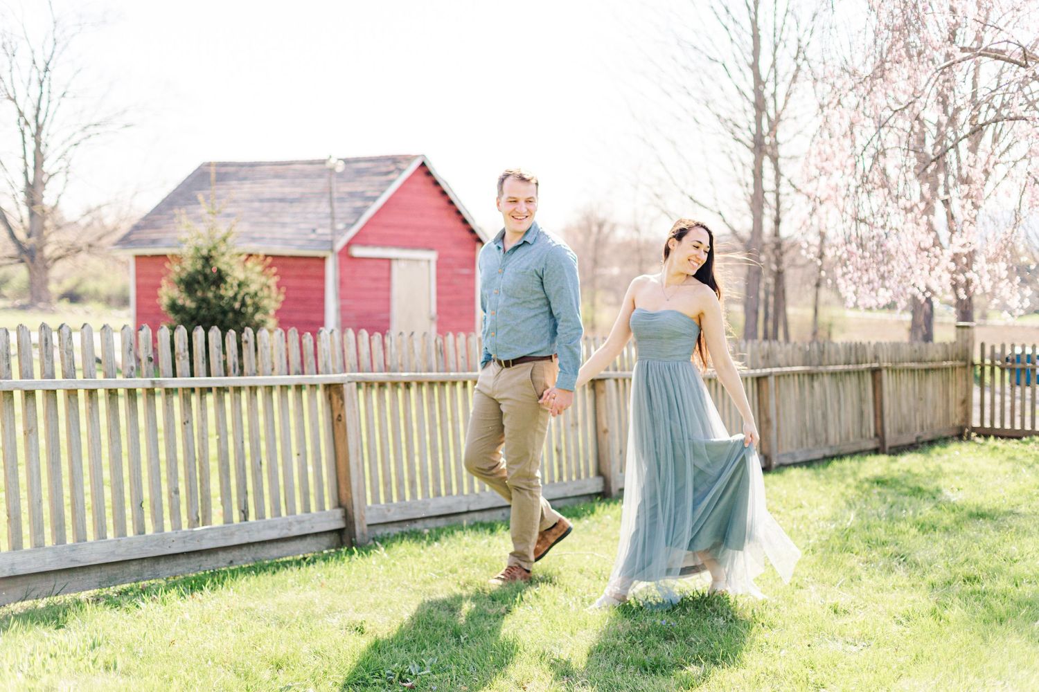 Couple dressed up in pastels walking during an anniversary session in New Paltz, NY